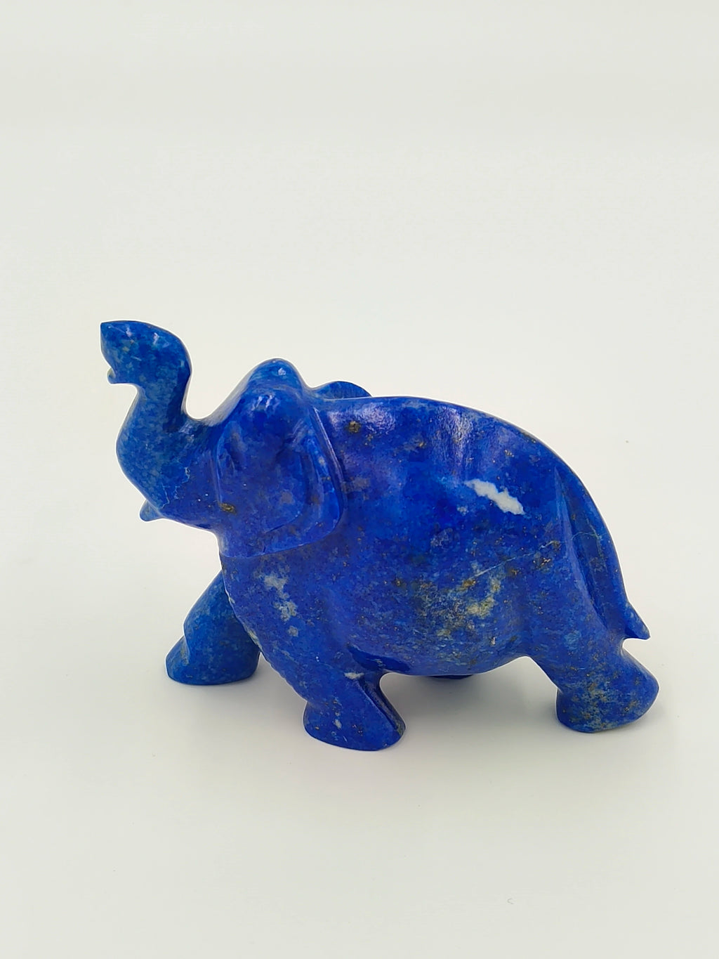 Small blue lapis elephant figurine sculpture with raised trunk