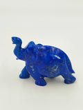 Small blue lapis elephant figurine sculpture with raised trunk