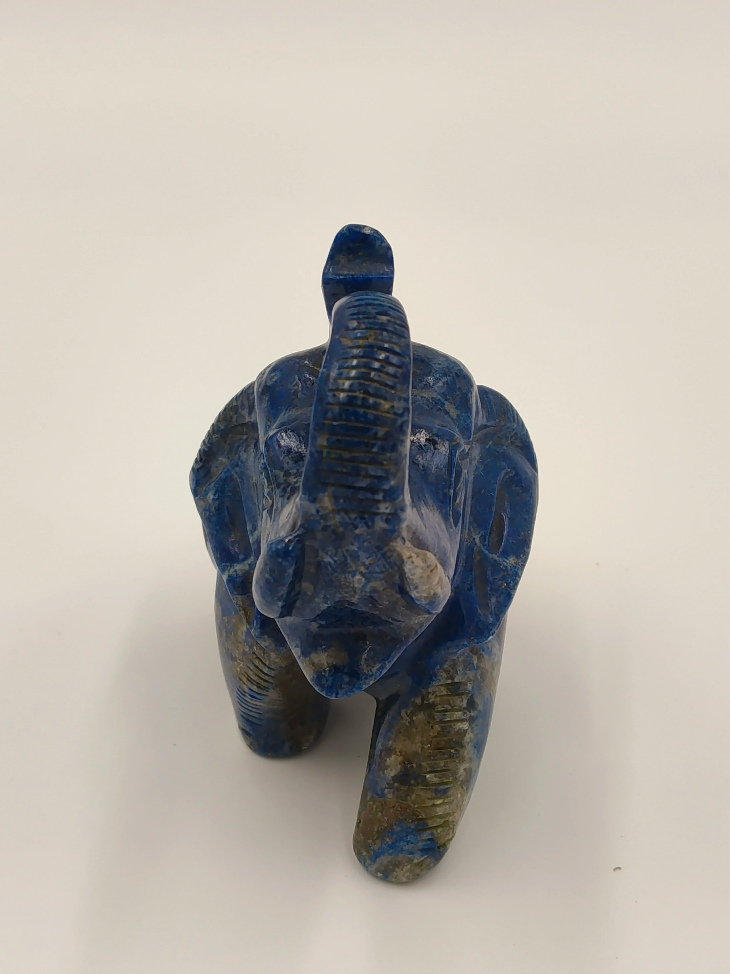 Front view of small blue lapis elephant figurine sculpture