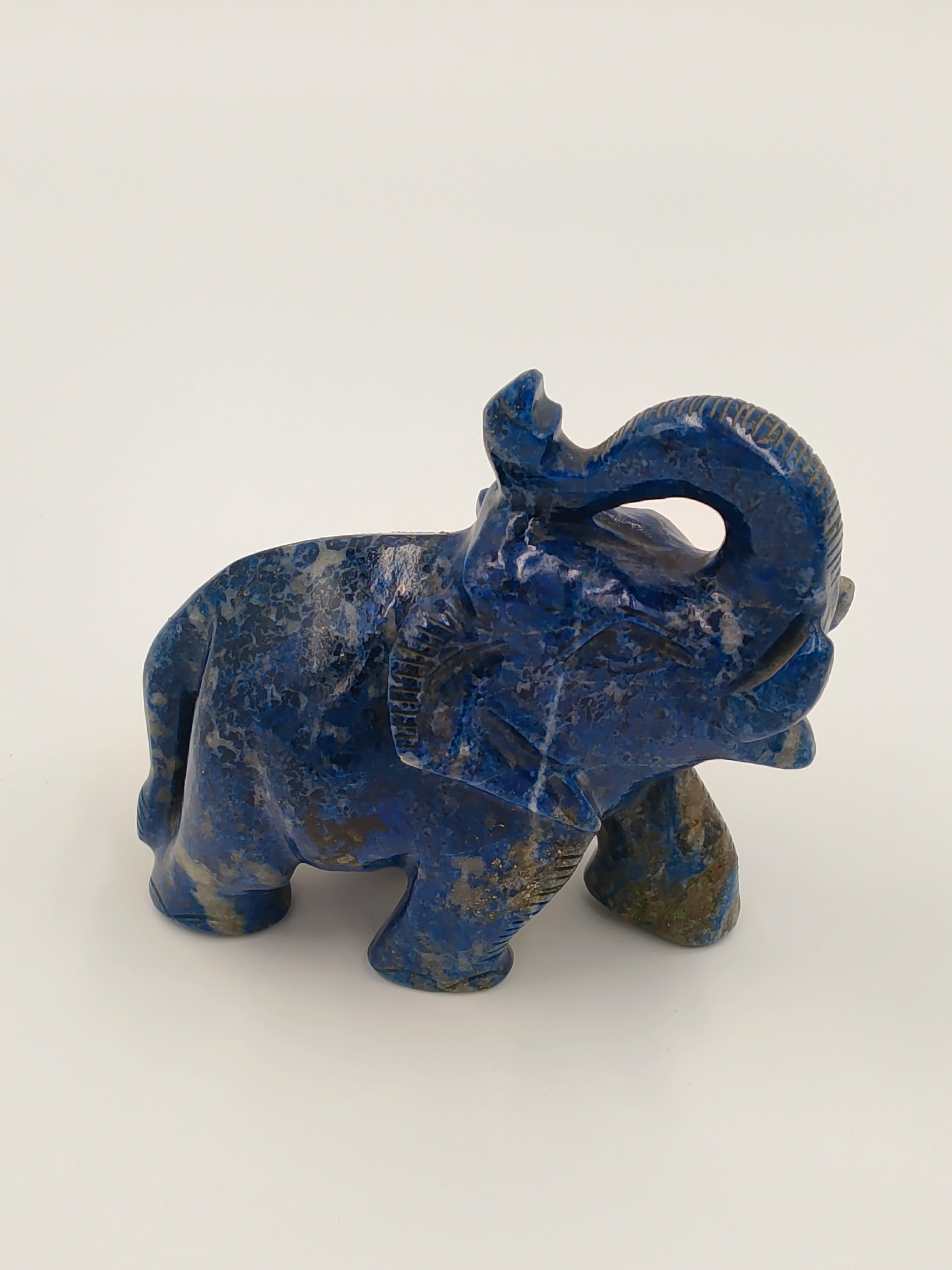 Small blue lapis lazuli elephant figurine sculpture with trunk raised