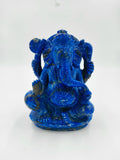 Blue lapis lazuli Ganesh statue sitting with four arms and intricate detailing