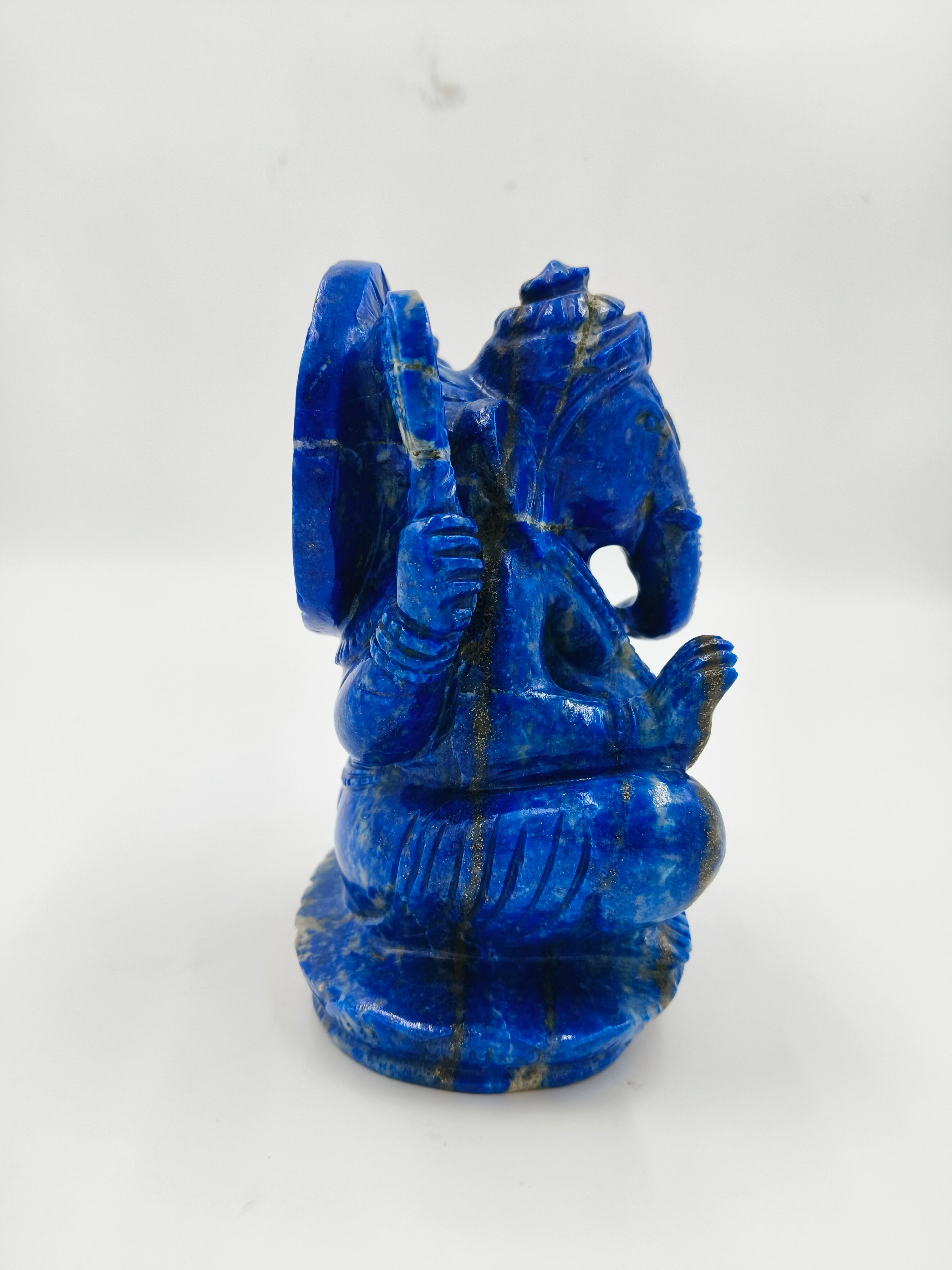 Lapis Lazuli Ganesh statue in seated pose, side view