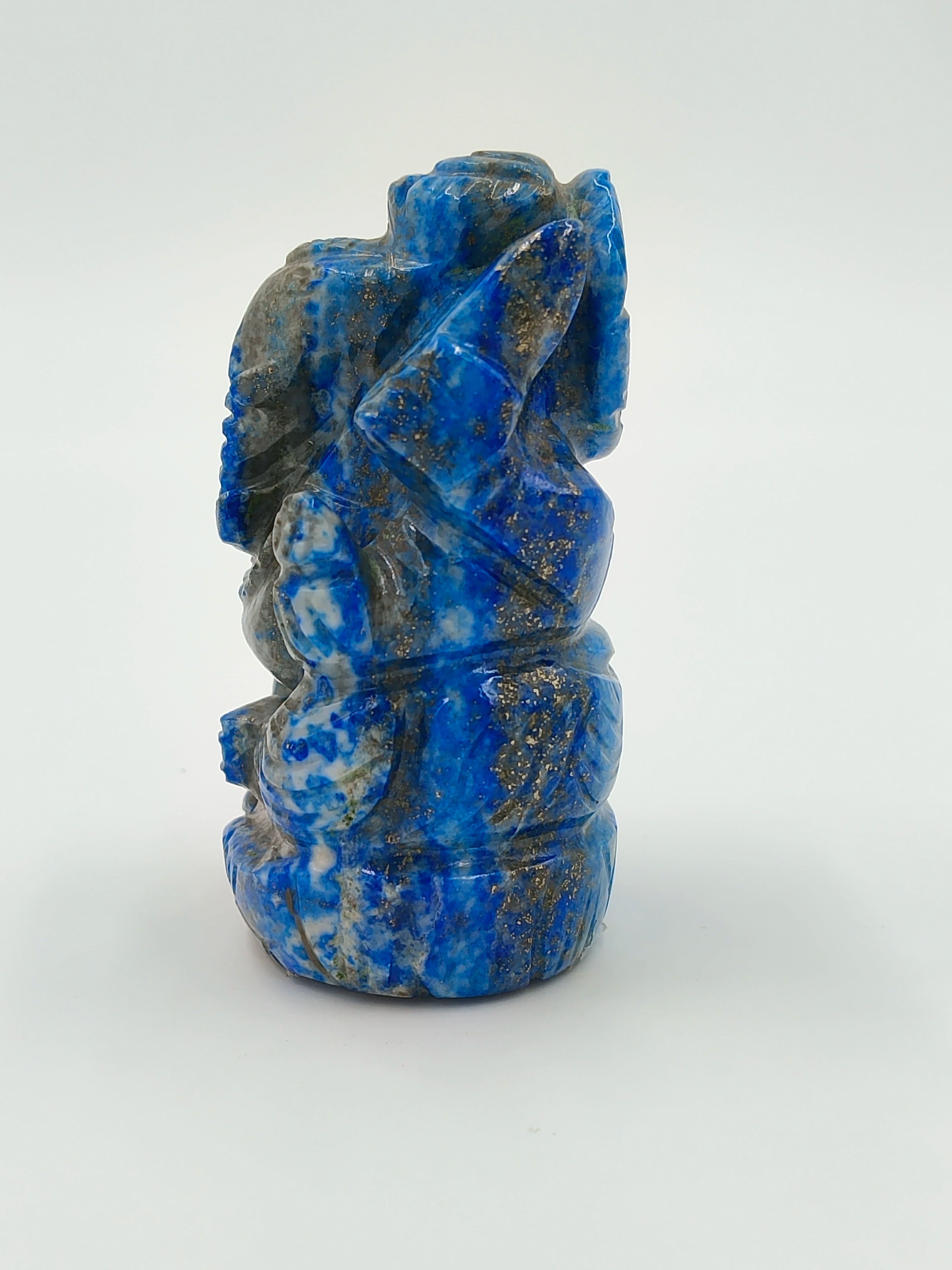 Lapis lazuli miniature Ganesh statue in blue and gold tones, side view