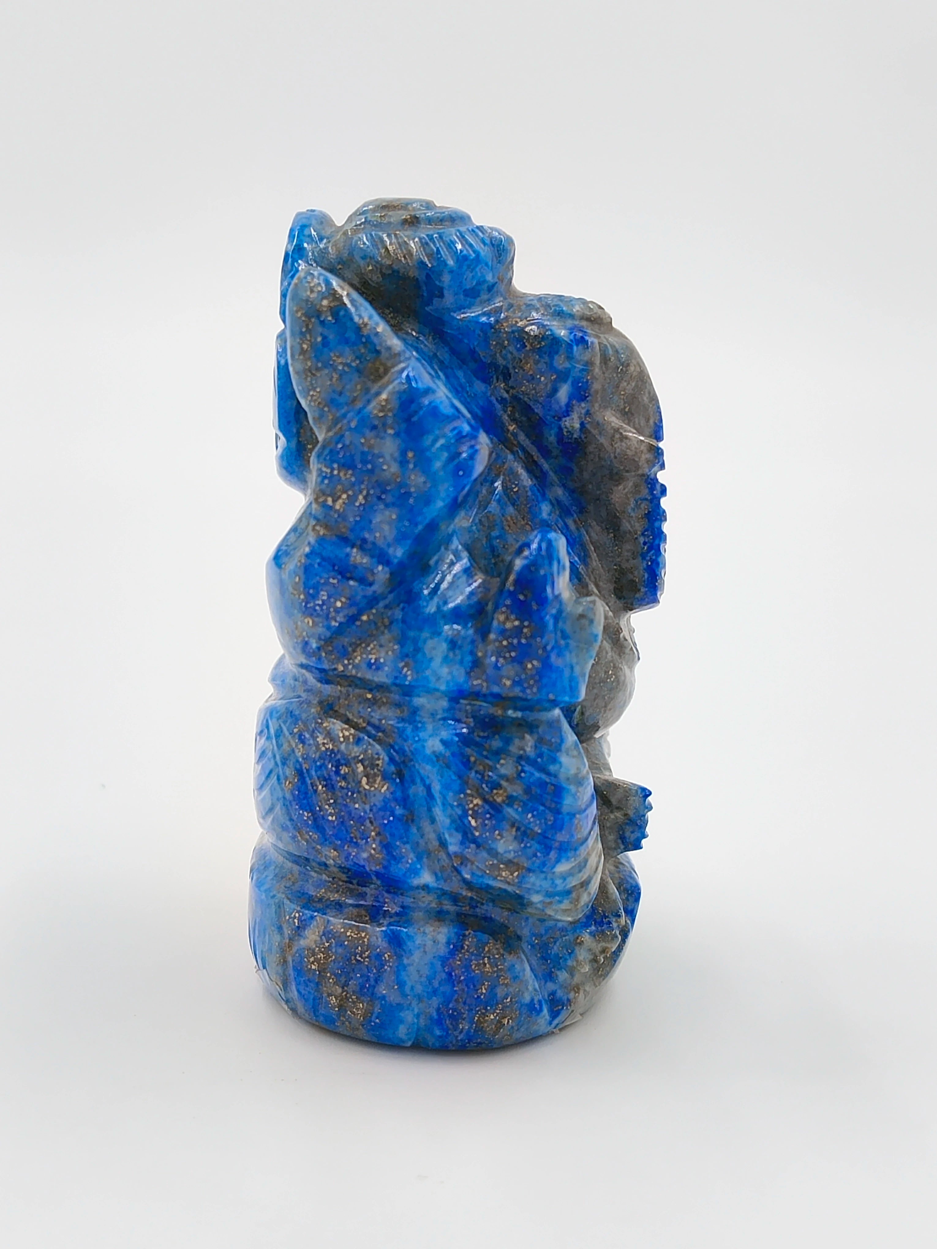Side view of a small blue lapis lazuli Ganesh sculpture