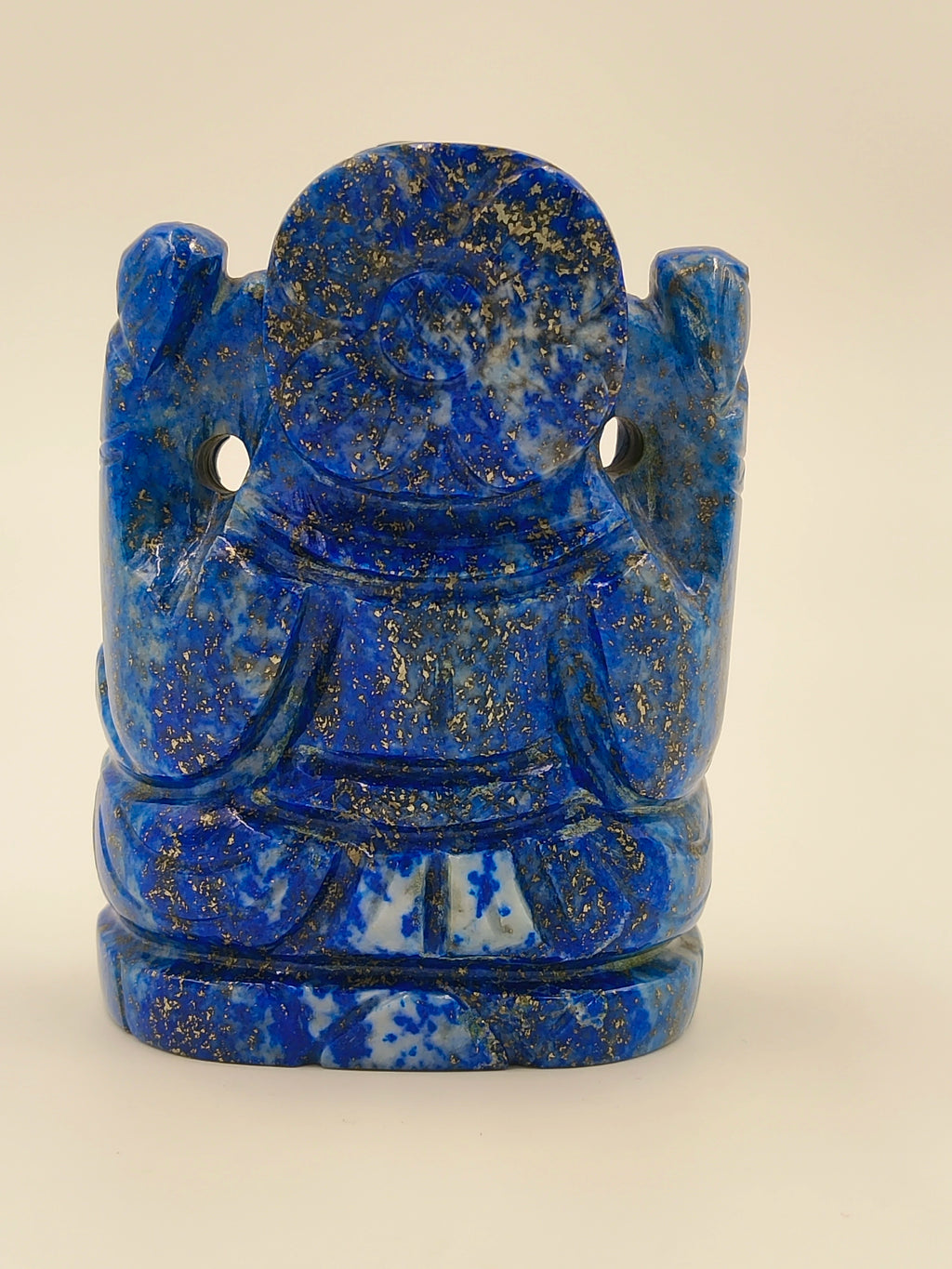 Back view of a small lapis lazuli Ganesh statue with intricate detailing