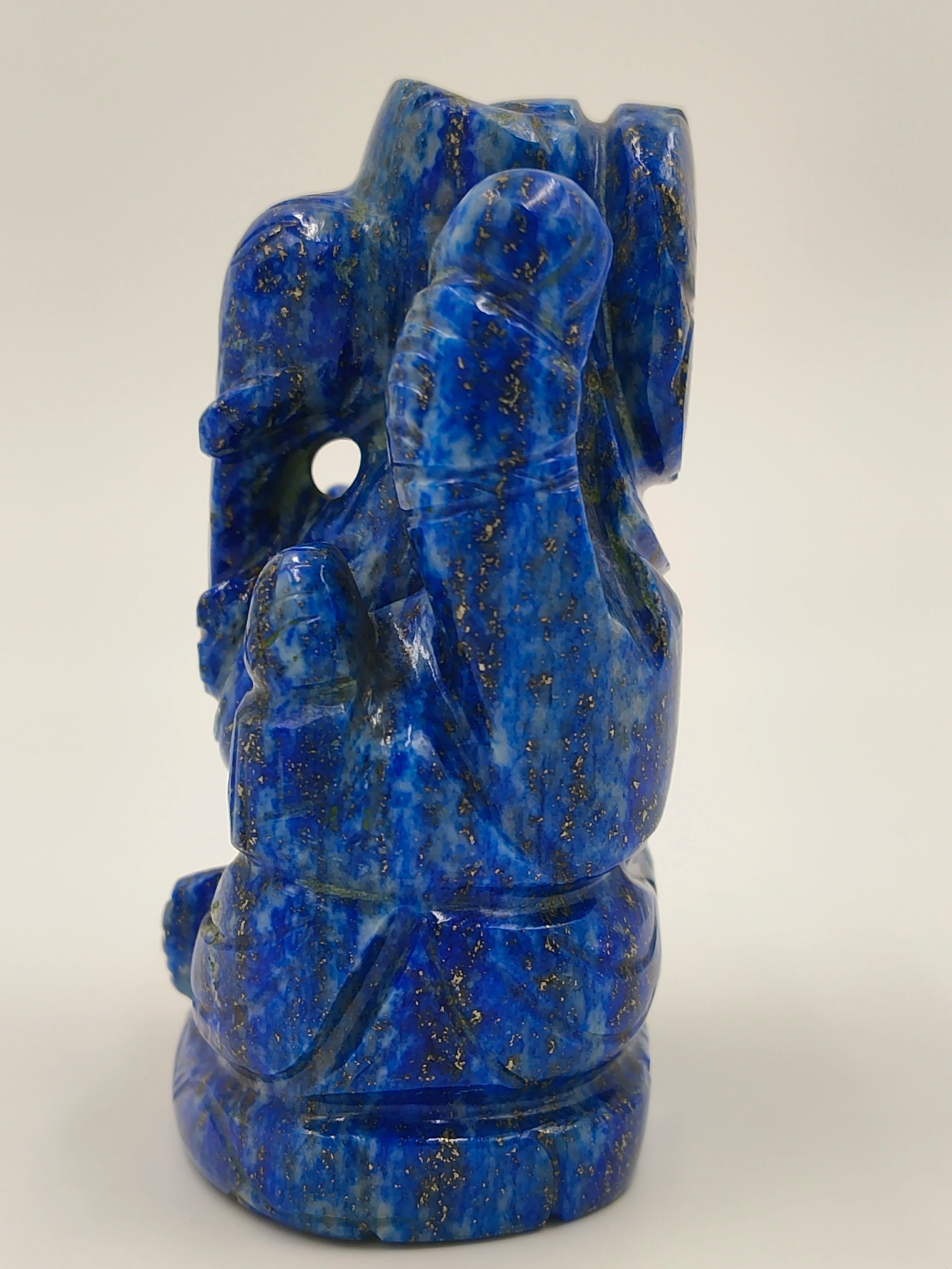 Side view of small lapis lazuli Ganesh statue with detailed carving