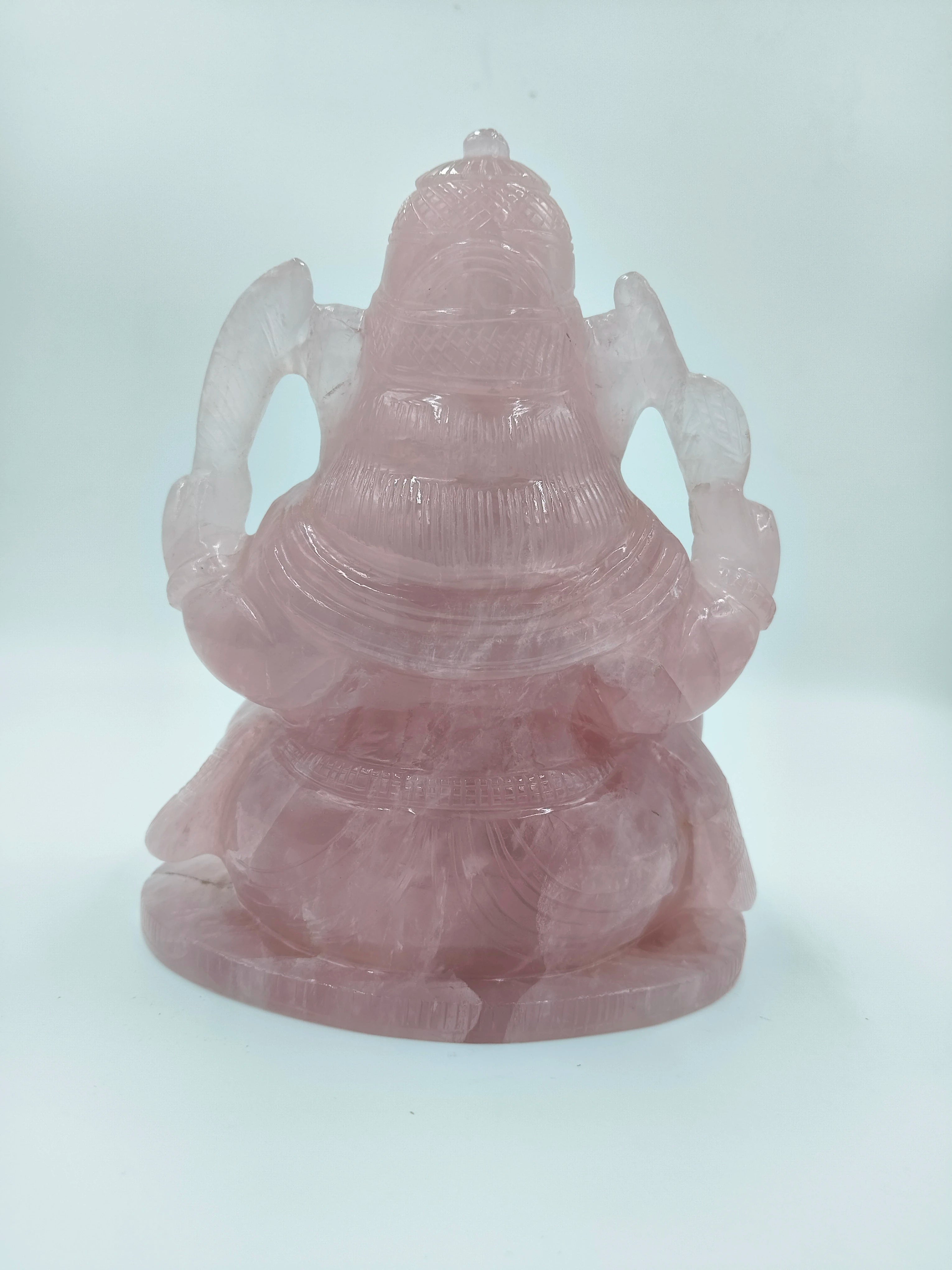 Back view of Rose Quartz Ganesh statue with detailed carving