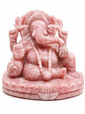 Large rose quartz statue of Ganesh seated on decorative base, front view