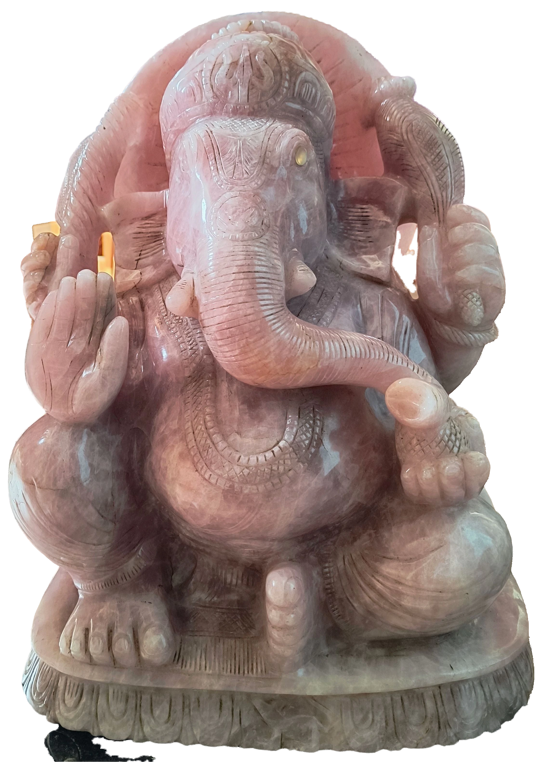 Rose quartz statue of Ganesh deity seated with detailed carvings