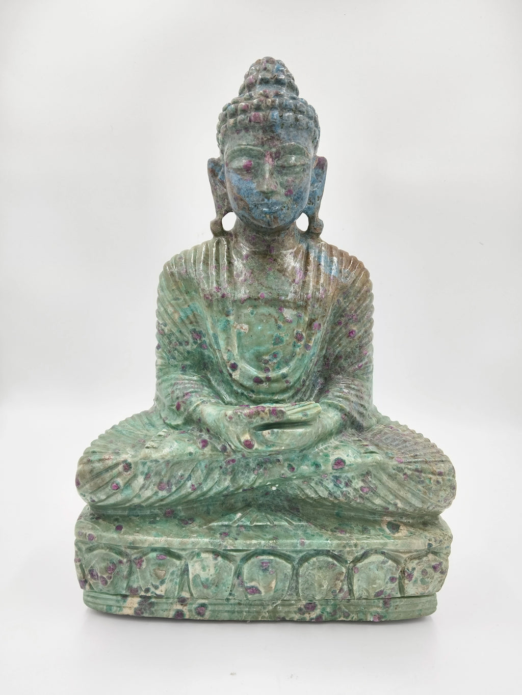 front view of seated Rubylite Buddha sculpture with green and purple hues