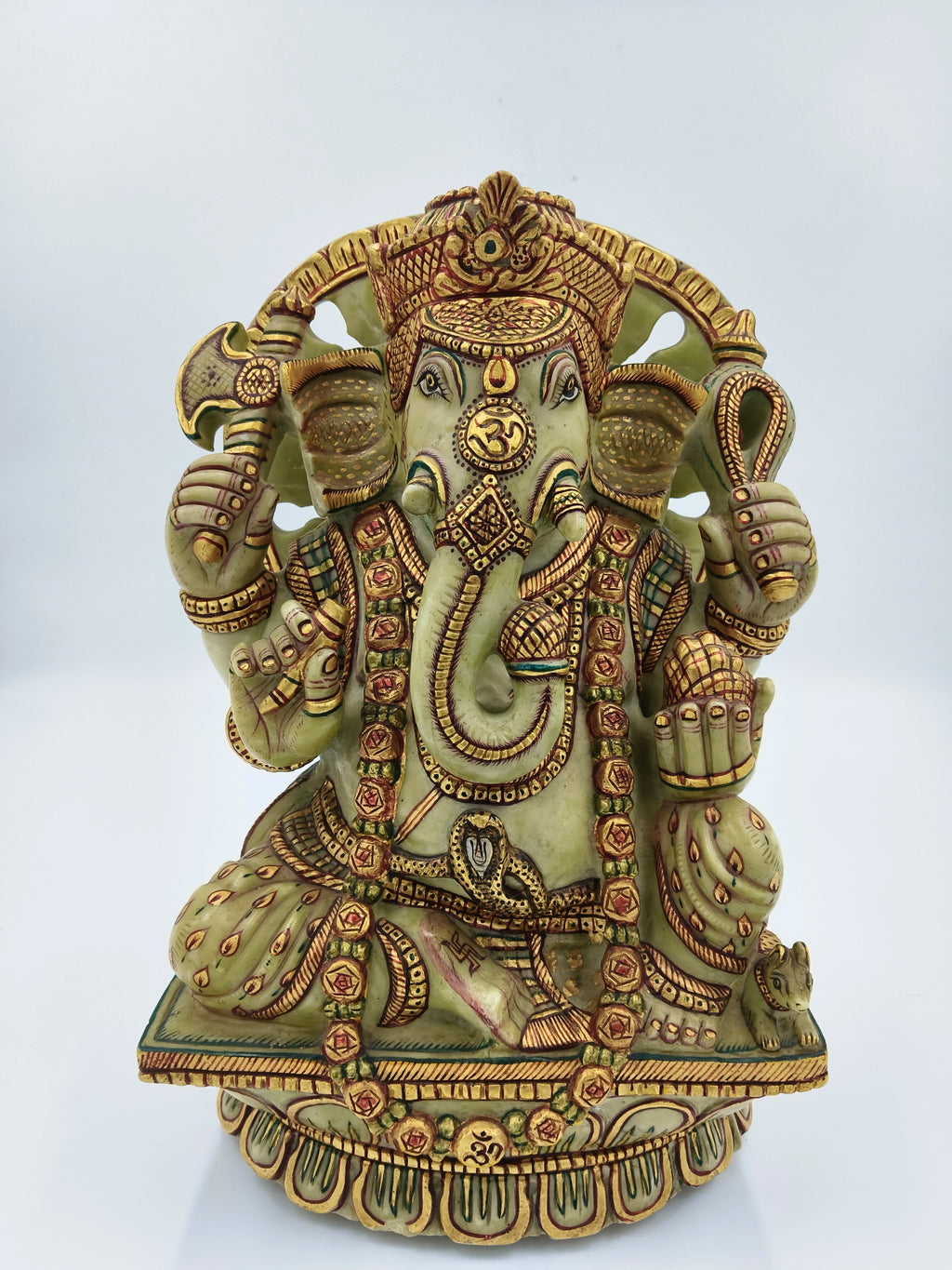 Large painted serpentine statue of Hindu deity Ganesh with detailed gold accents