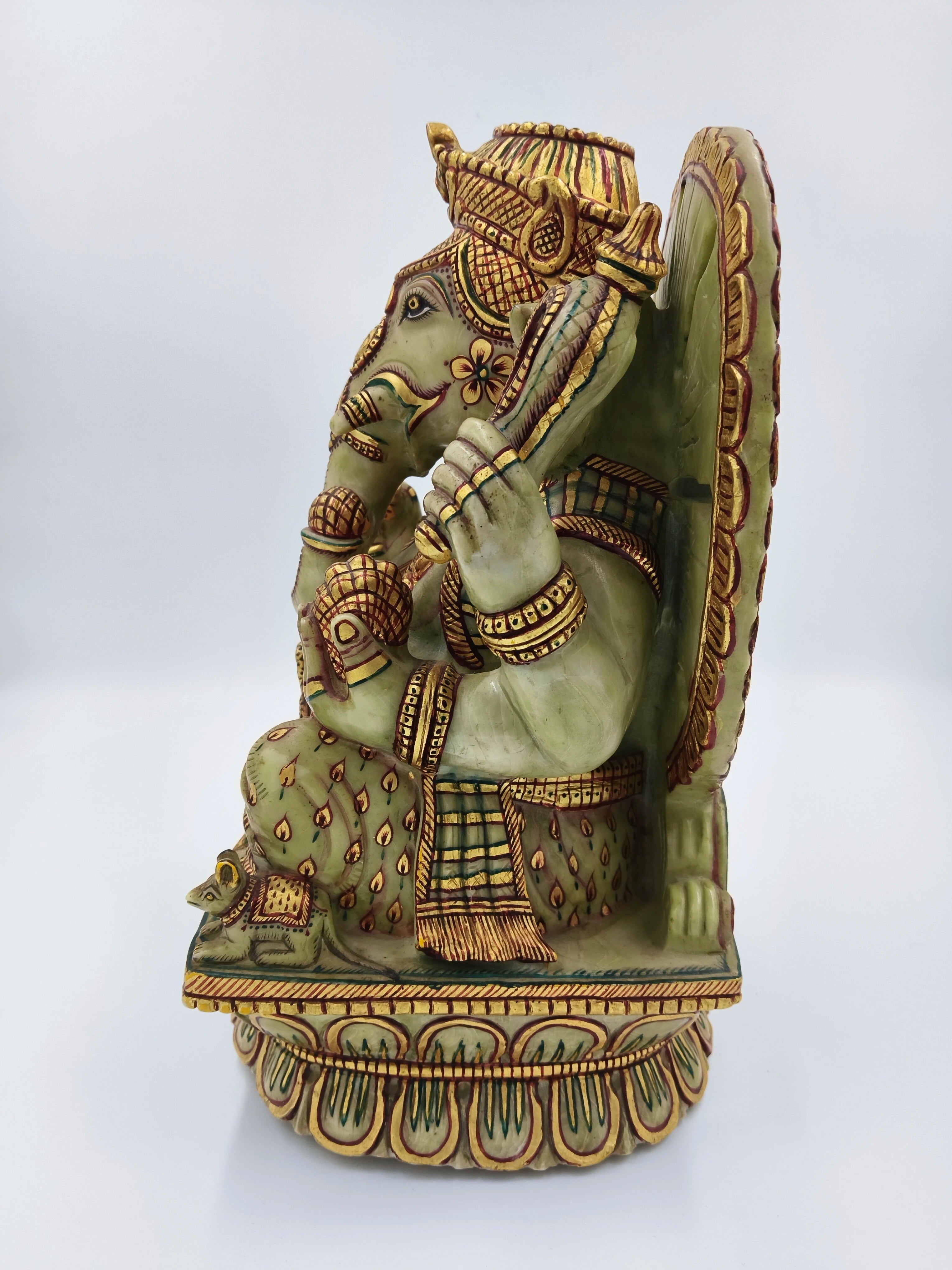 Side view of large painted serpentine Ganesh statue with detailed decorations