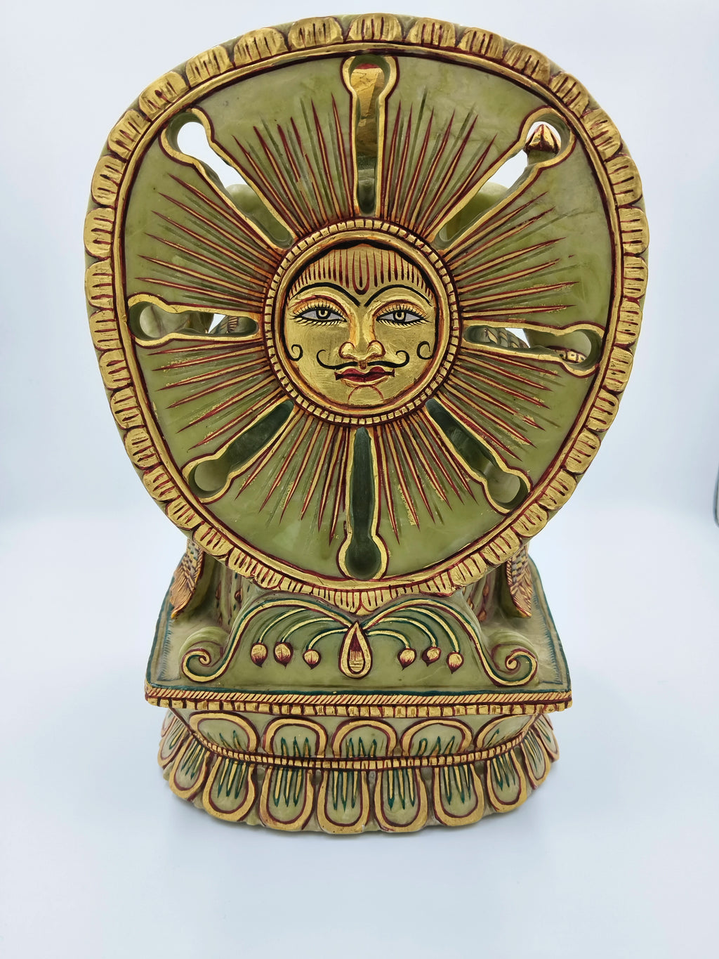 Back view of painted serpentine Ganesh sculpture with sun motif and intricate designs