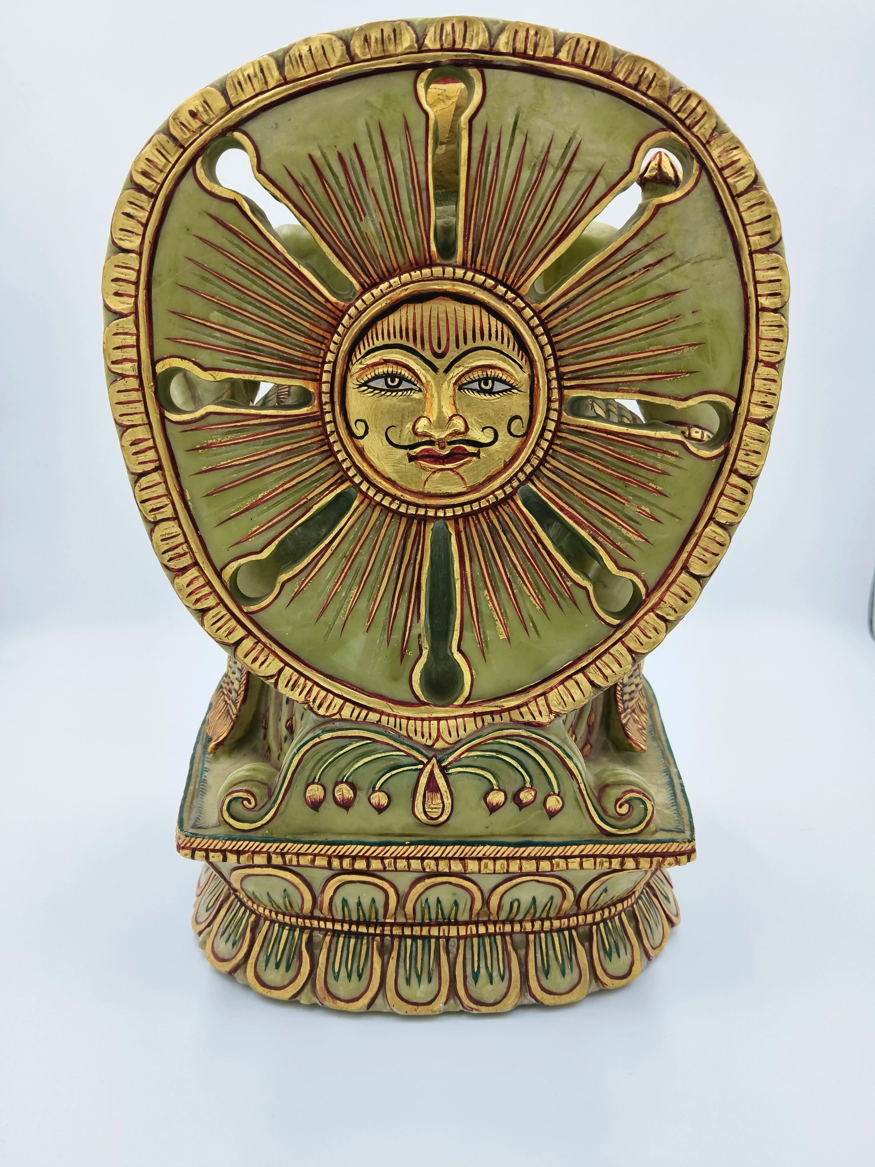 Back view of painted serpentine Ganesh sculpture with sun motif and intricate designs