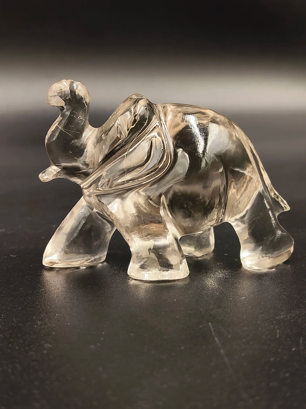 Clear crystal elephant figurine sculpture with trunk raised