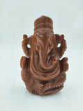 Front view of a carved Sunstone Ganesh idol sculpture