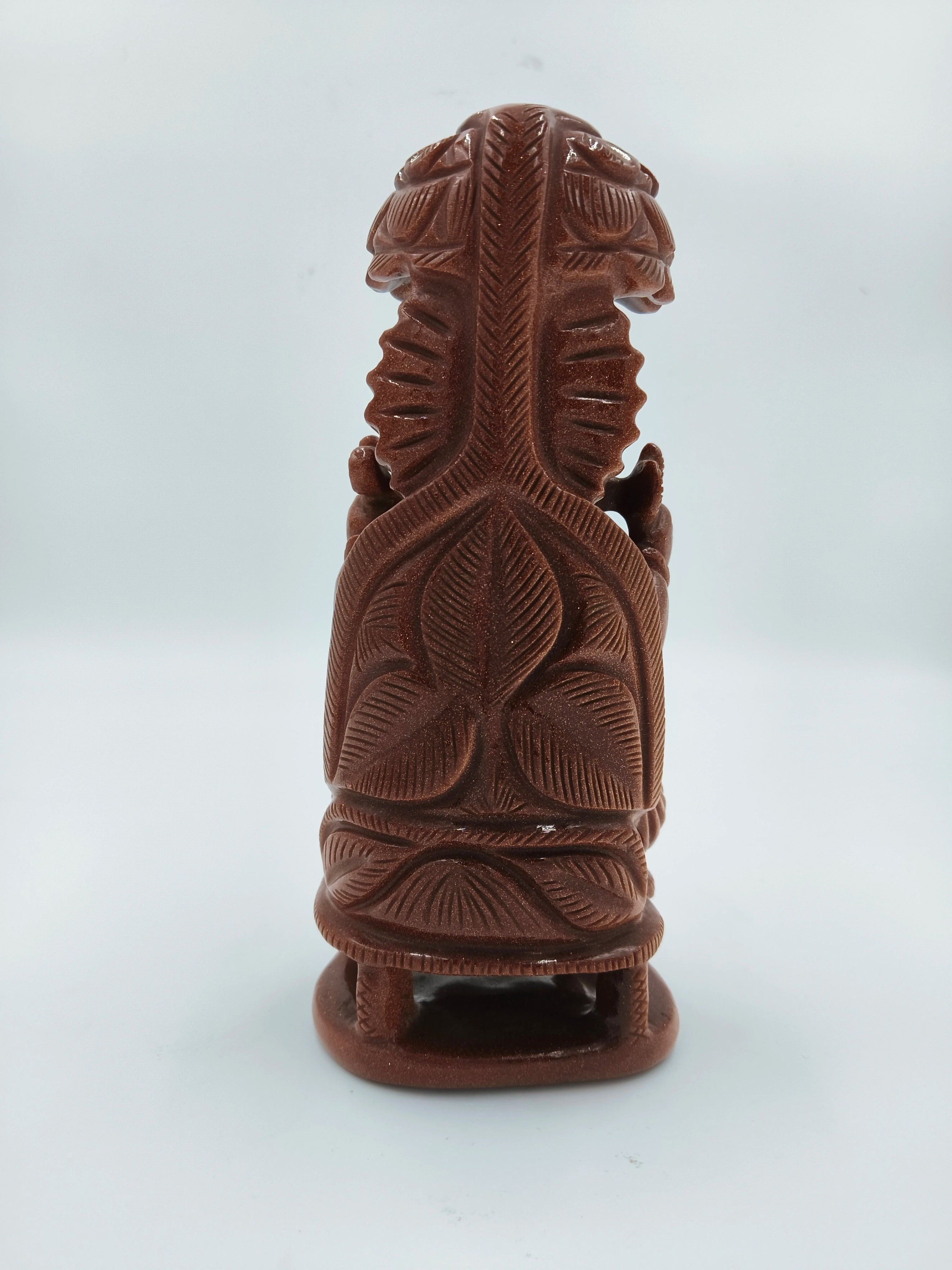 Back view of 7-inch sunstone Ganesh sculpture with detailed carvings