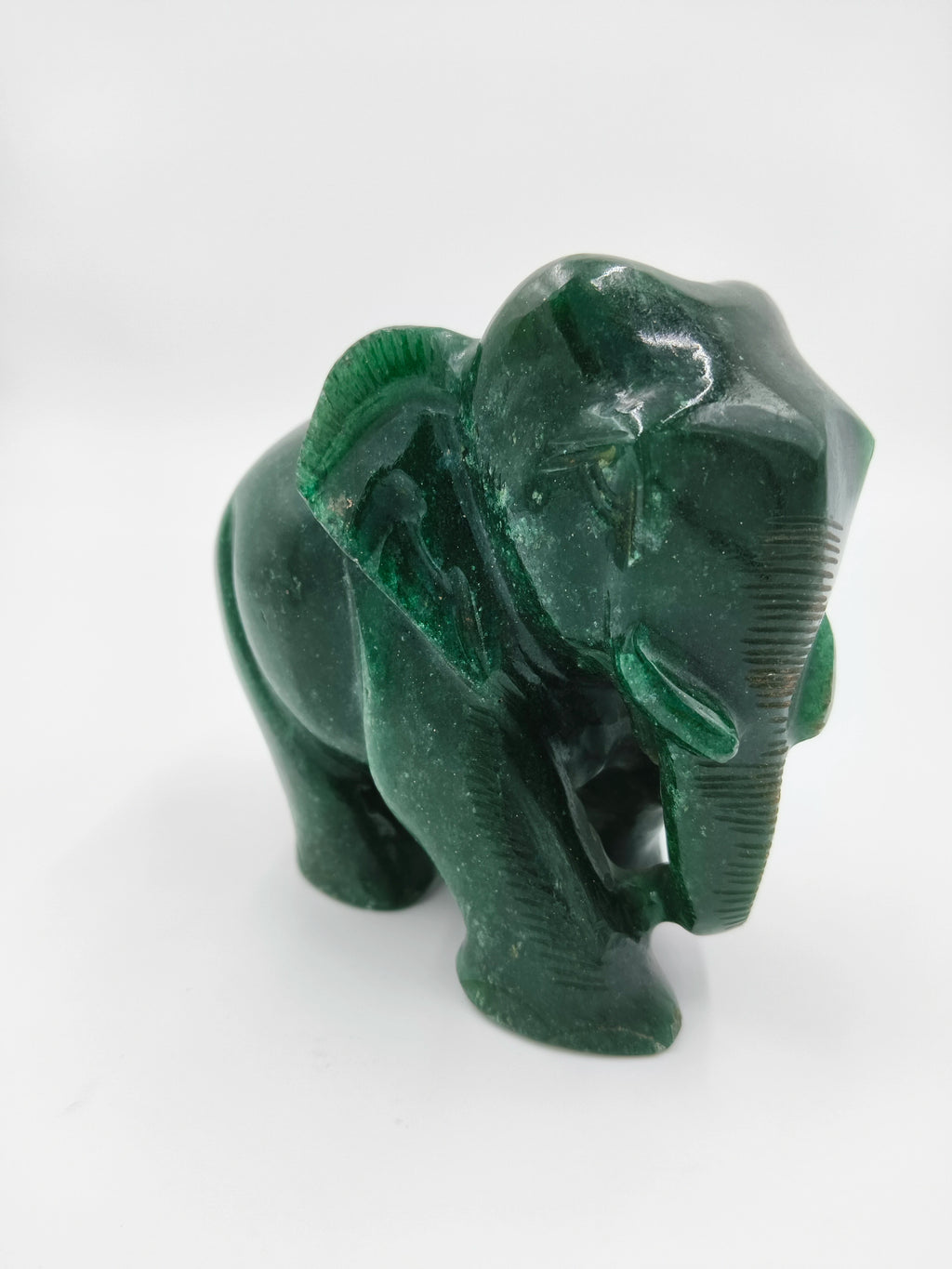 Small green jade elephant figurine sculpture side view