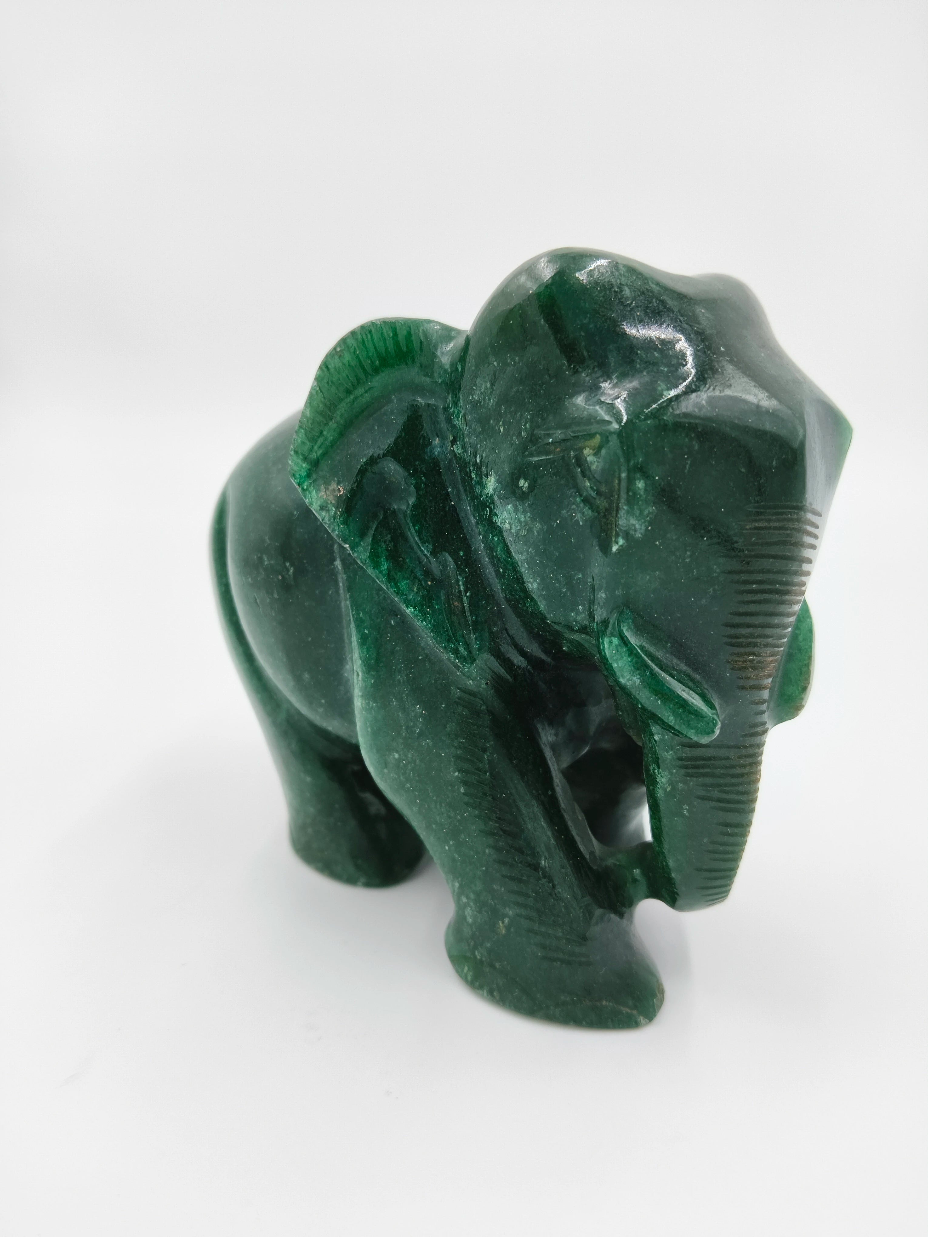 Small green jade elephant figurine sculpture side view