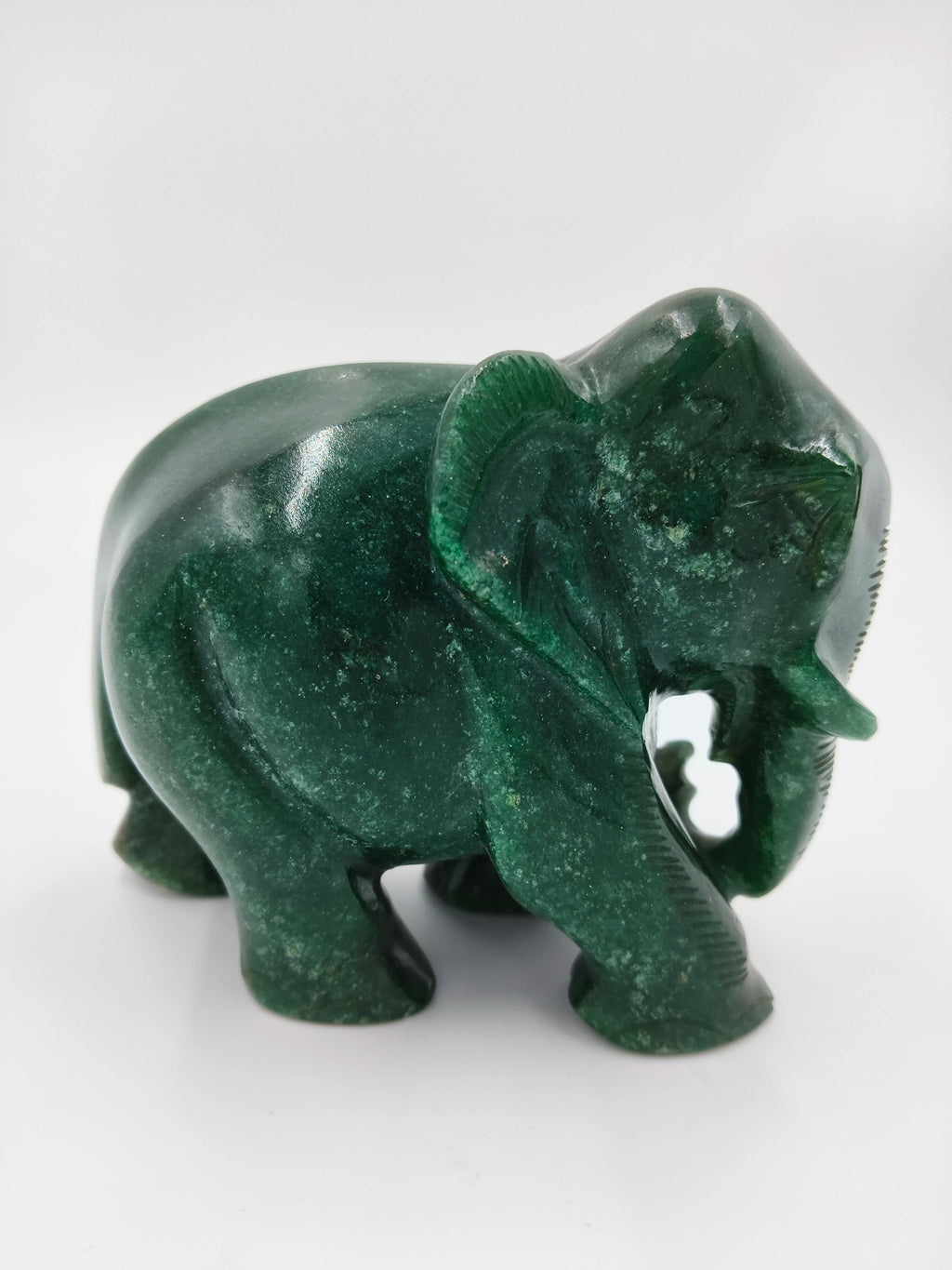 Small polished jade elephant figurine sculpture in green