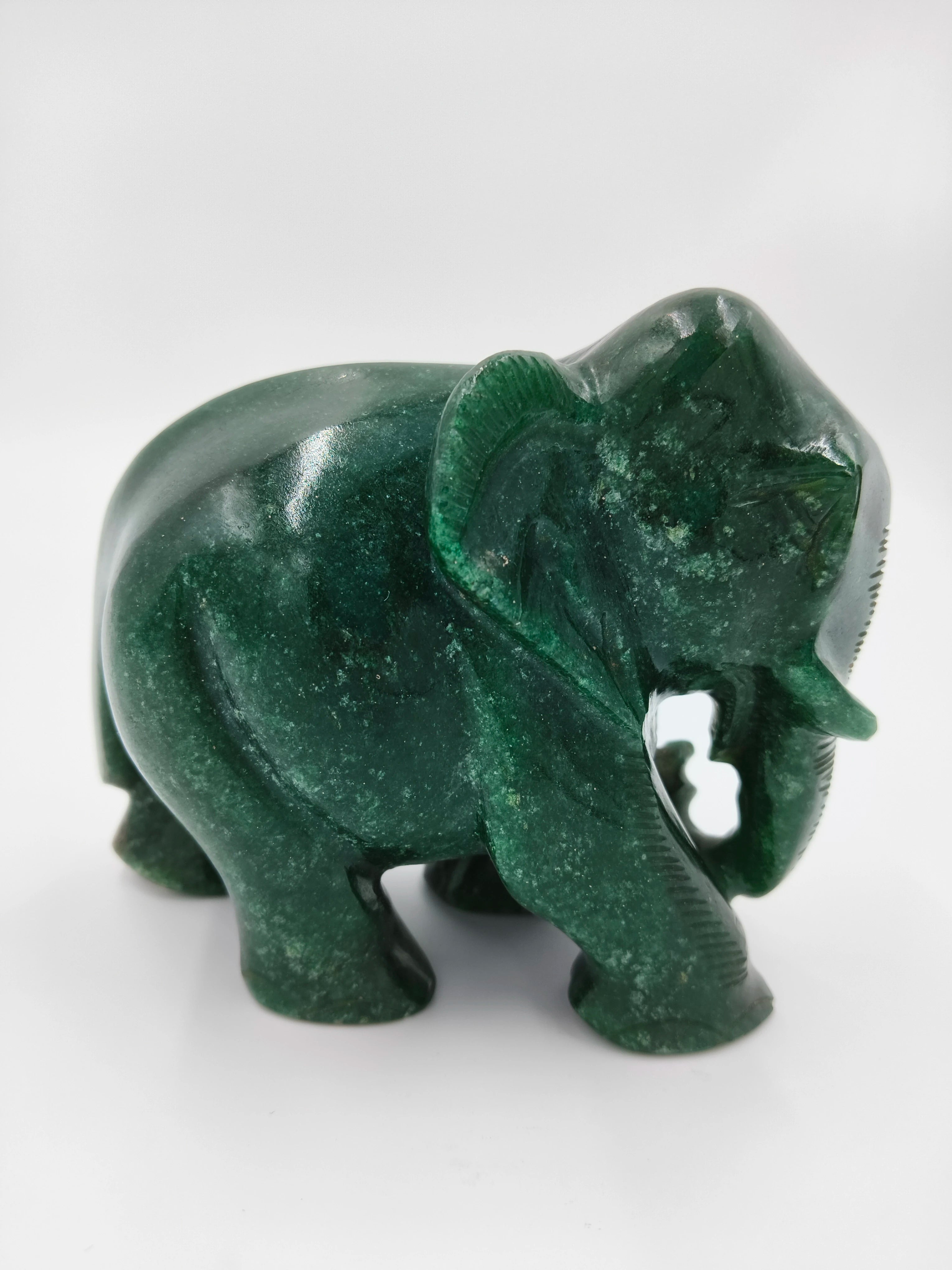 Small polished jade elephant figurine sculpture in green