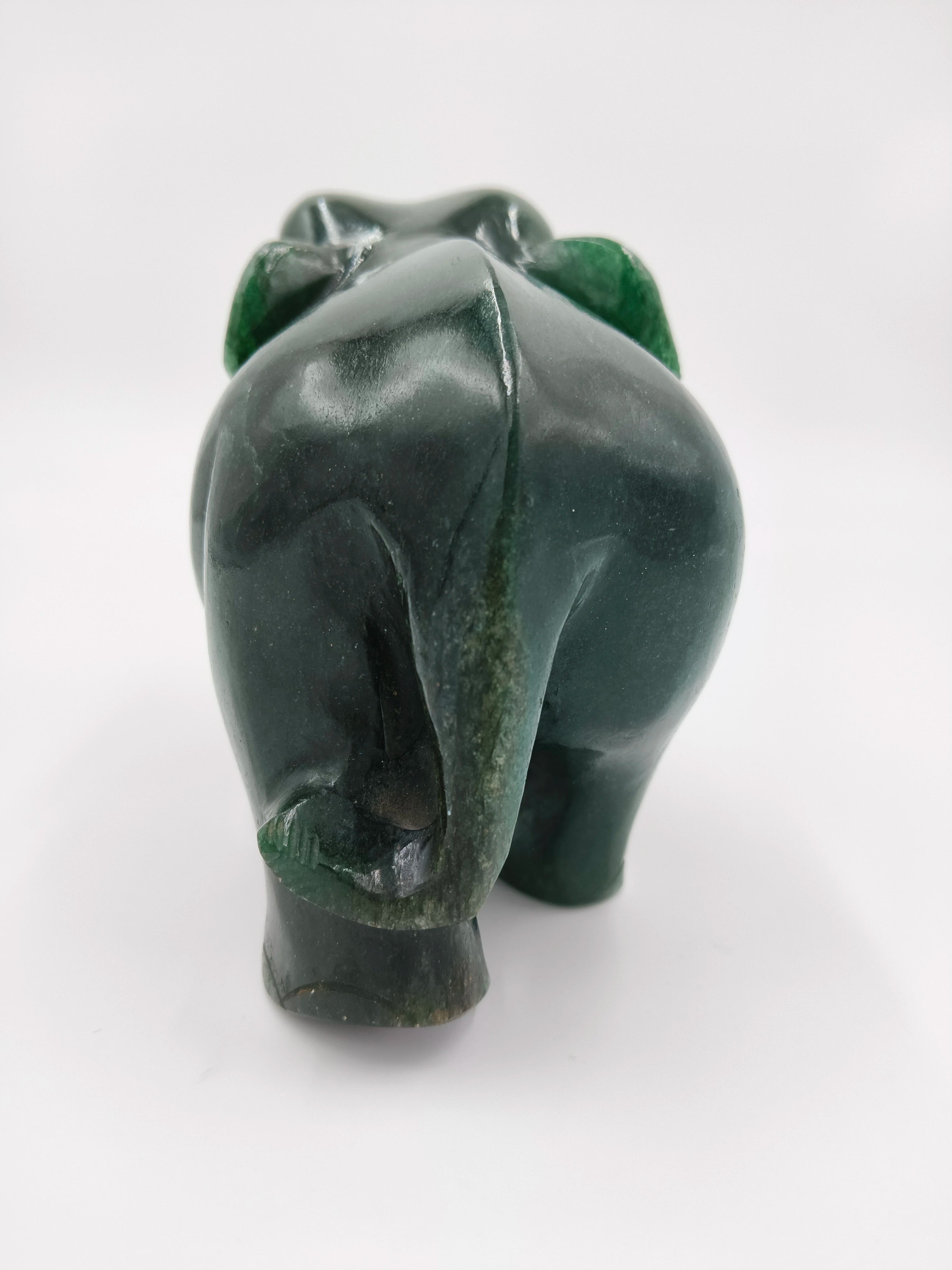 Rear view of small green jade elephant sculpture