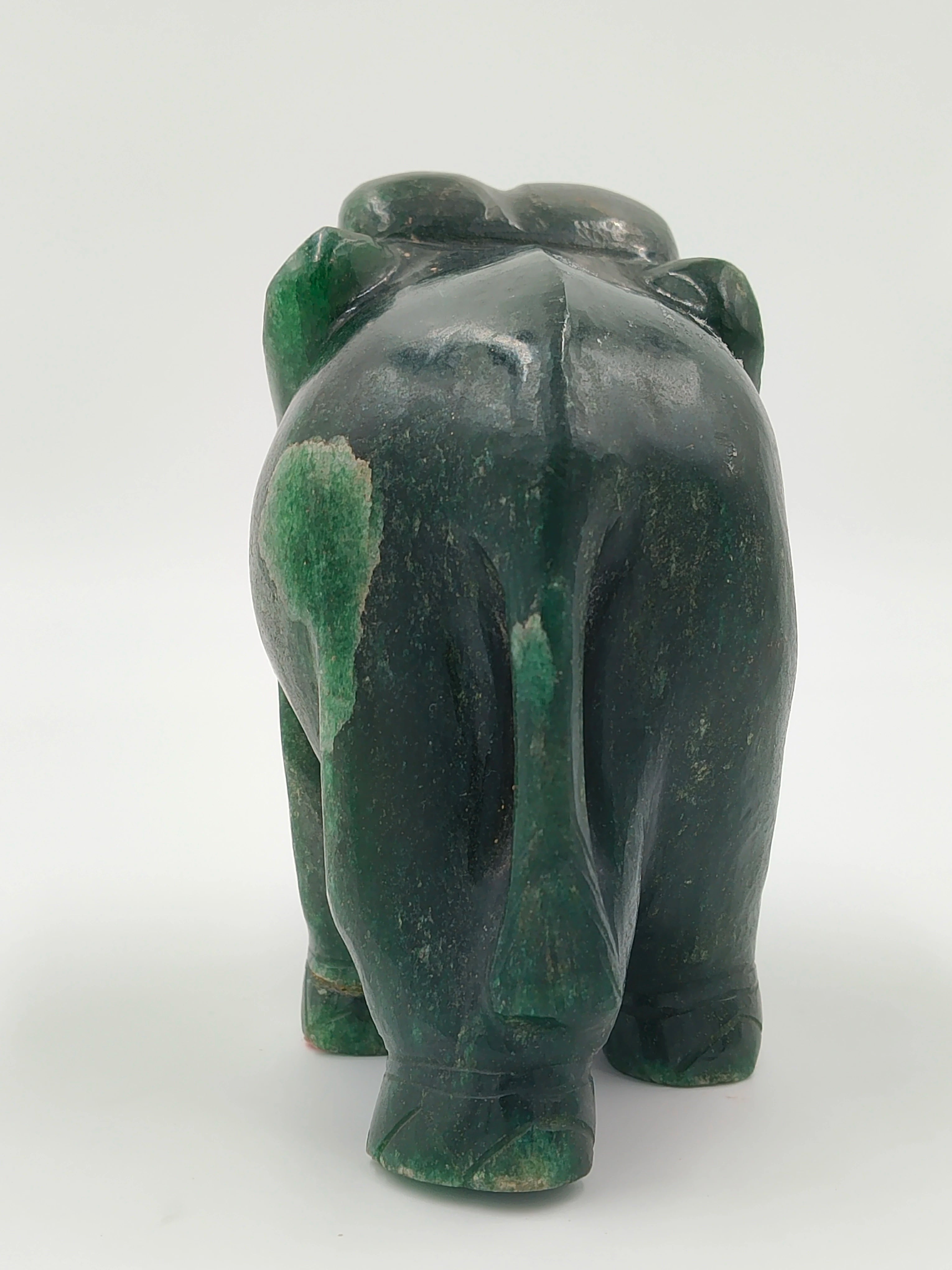 Back view of a medium-sized green jade elephant sculpture