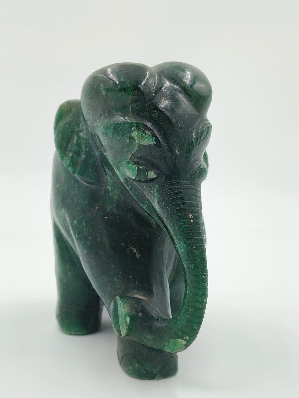 Dark green jade elephant figurine sculpture front view