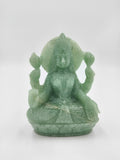 Jade statue of goddess Lakshmi seated in lotus position with four arms