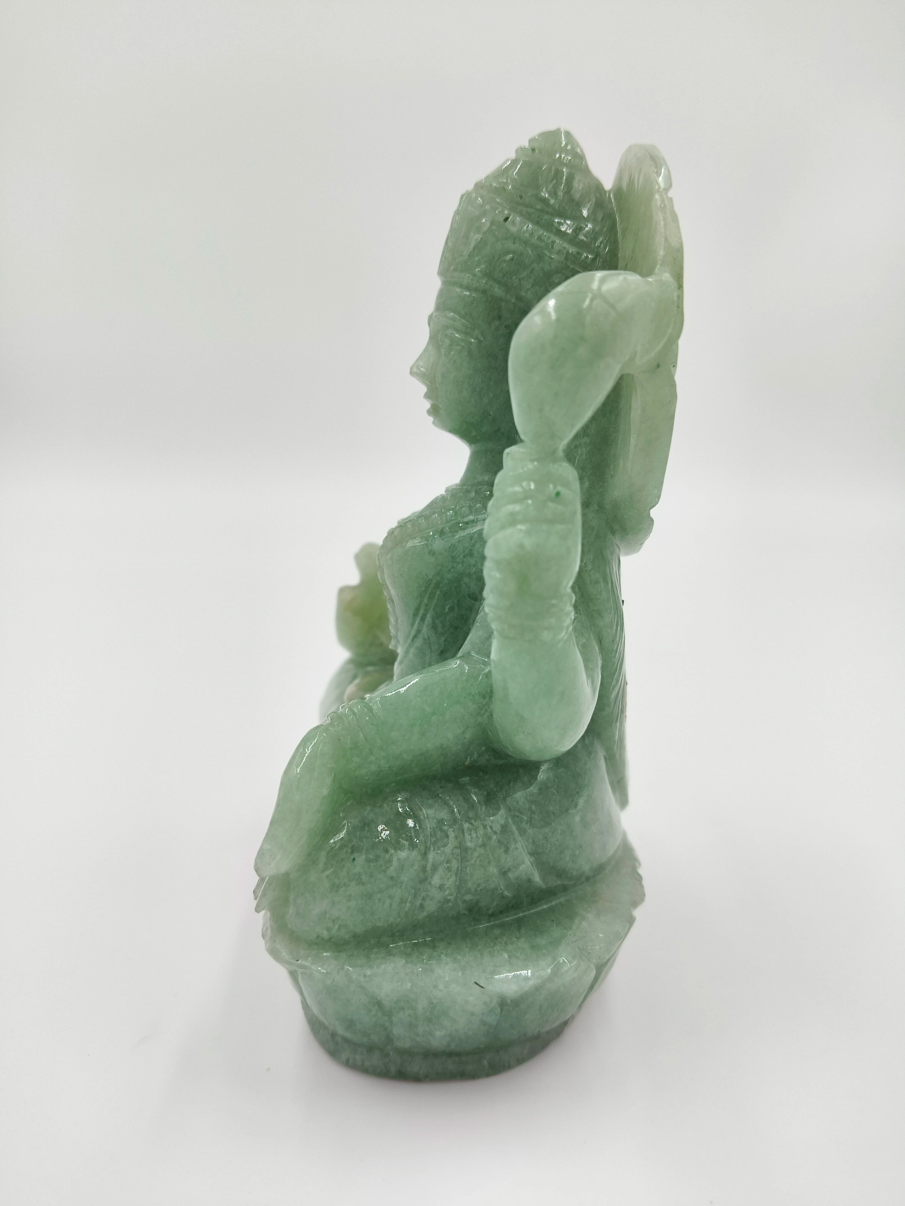 Side view of 4.3 inch jade sculpture of goddess Lakshmi in seated posture