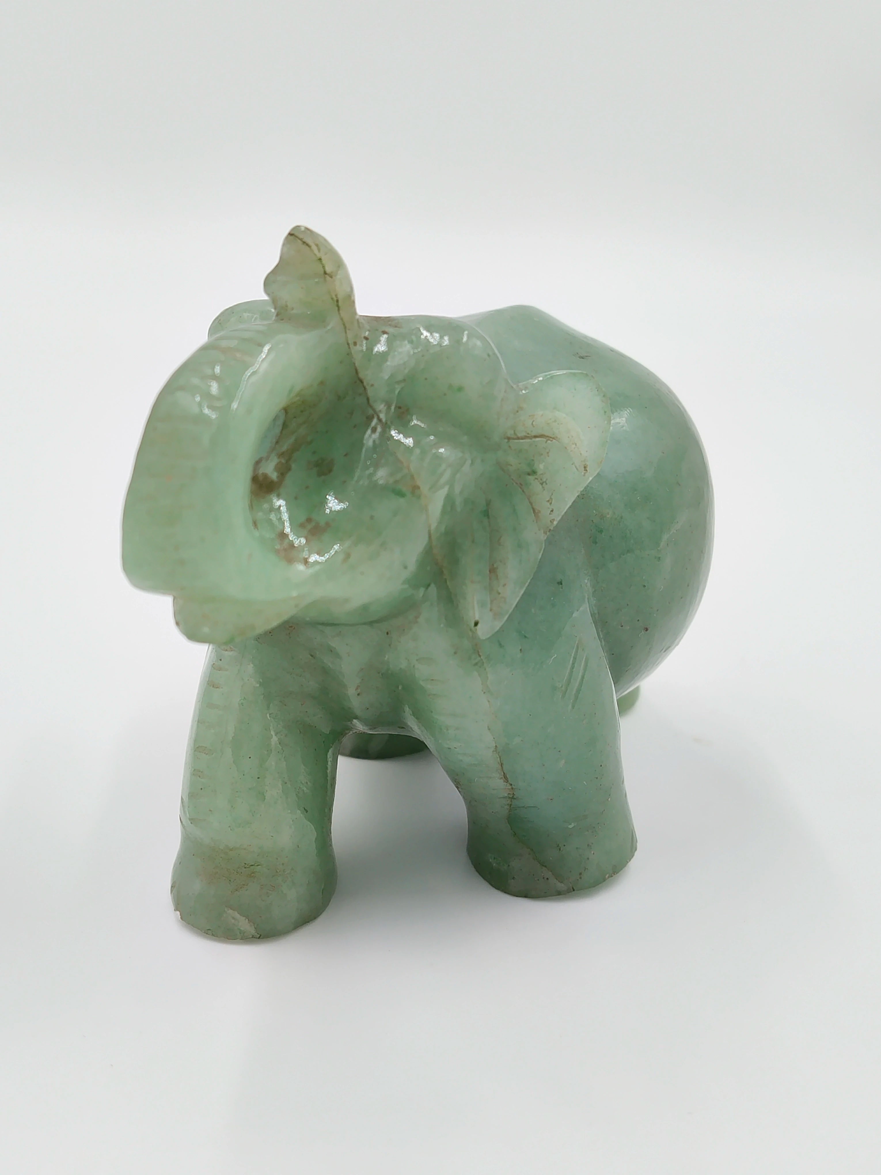 Small jade elephant figurine sculpture with raised trunk tabletop decor