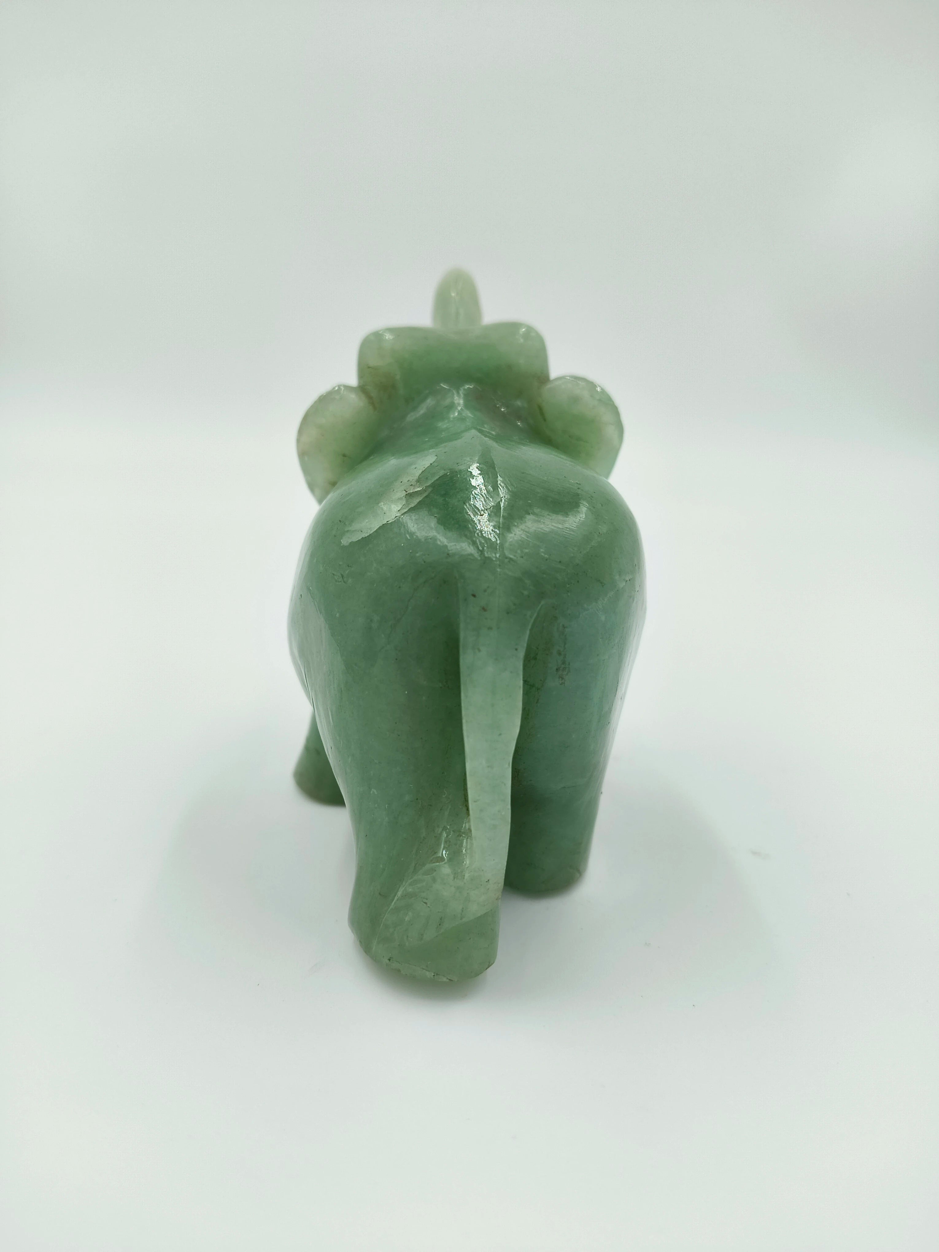 Small green jade elephant figurine viewed from the rear