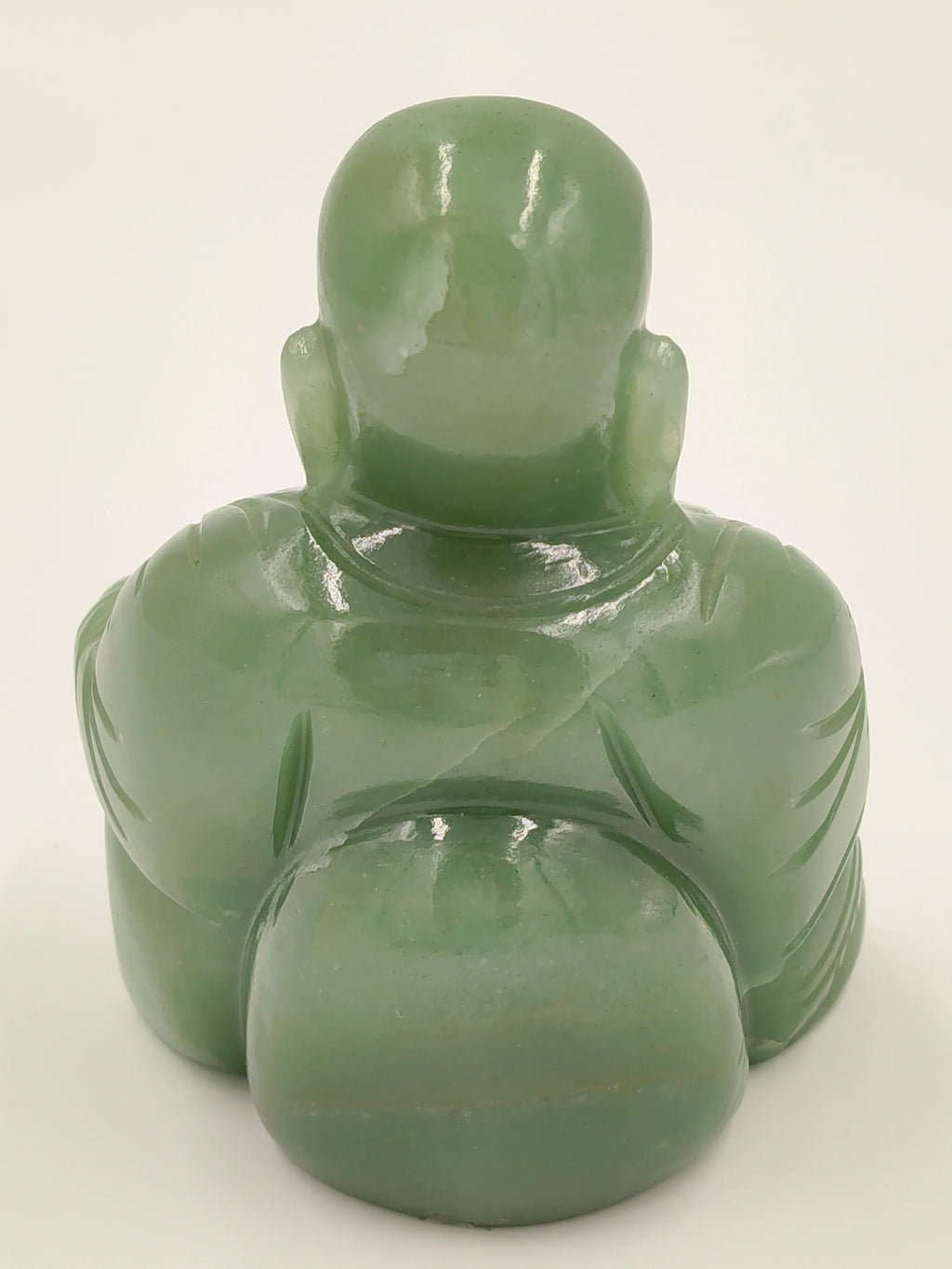 Back view of small jade Laughing Buddha idol sculpture