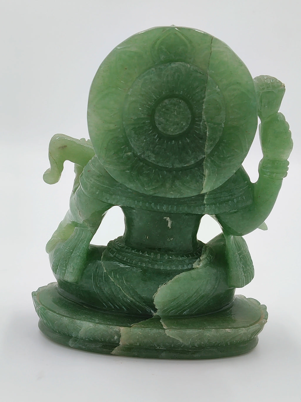 Back view of medium-sized jade sculpture of deity Saraswathi sitting on lotus base