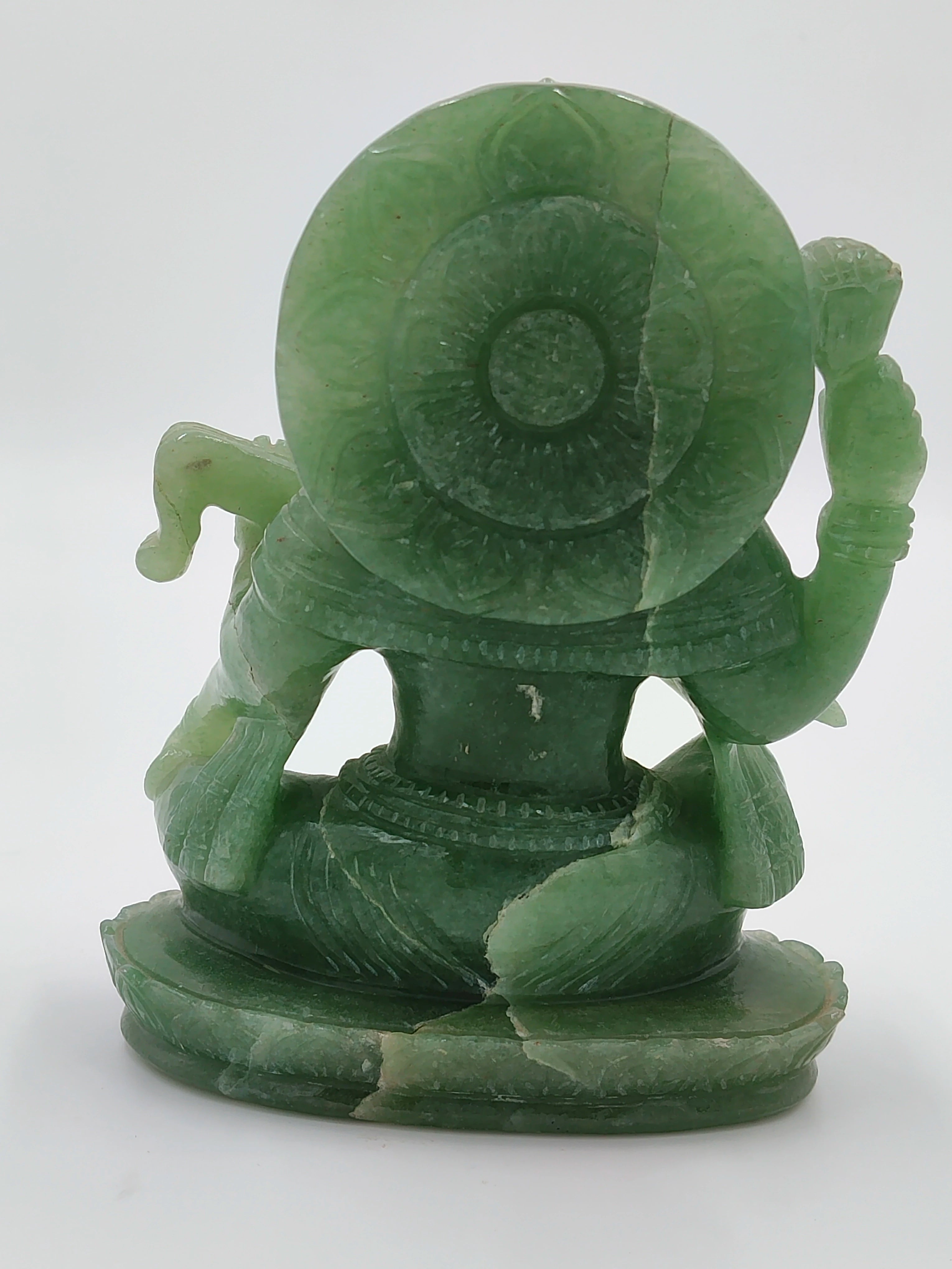 Back view of medium-sized jade sculpture of deity Saraswathi sitting on lotus base
