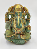 Front view of jade Ganesh statue with gold painting and intricate details