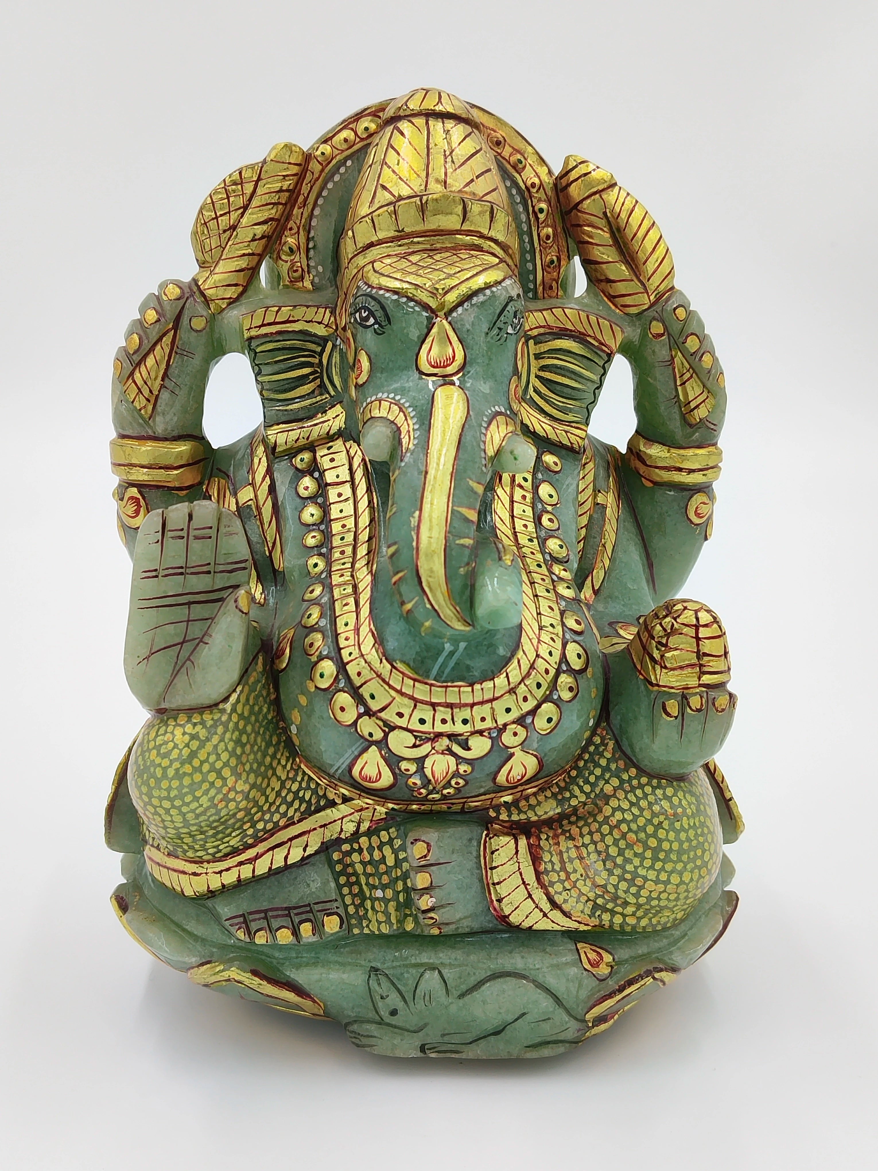 Front view of jade Ganesh statue with gold painting and intricate details