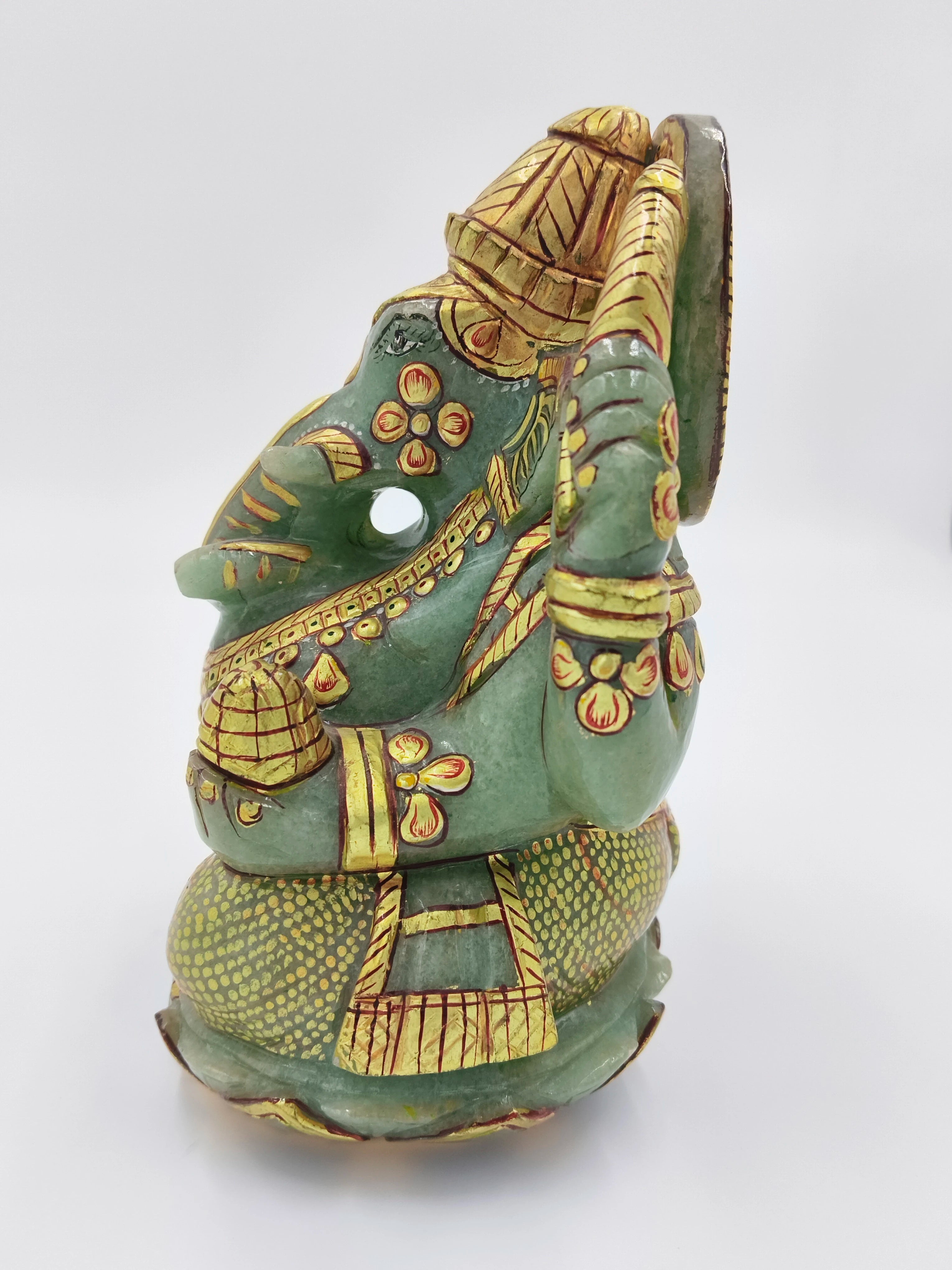 Side view of jade Ganesh sculpture with gold painting, 5.9 inches tall
