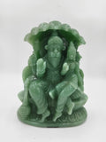 Green jade sculpture of Lakshmi Narasimha deity seated under a canopy