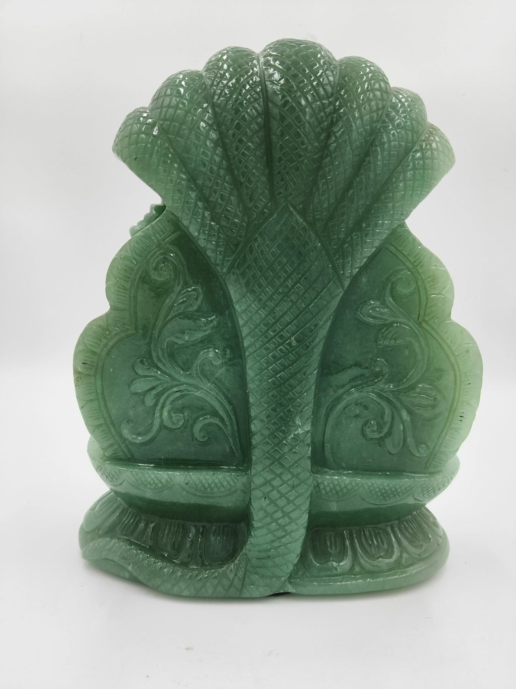 Rear view of a green jade Lakshmi Narasimha sculpture with intricate carvings