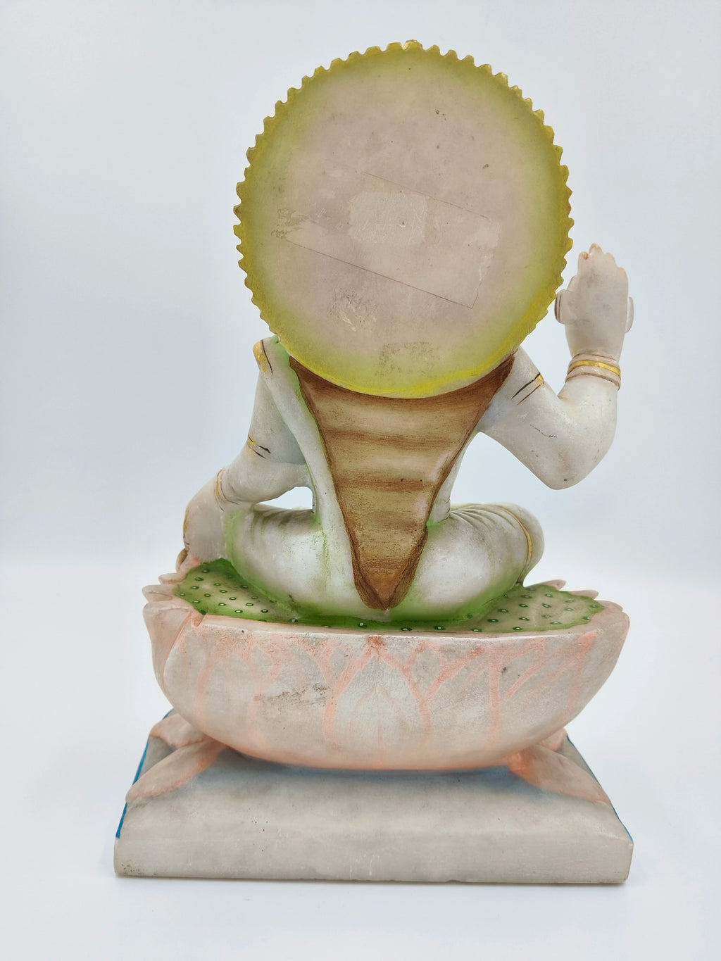 Back view of marble Gayatri sculpture seated on lotus base