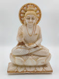 White marble Buddha statue sitting on lotus with gold accents front view