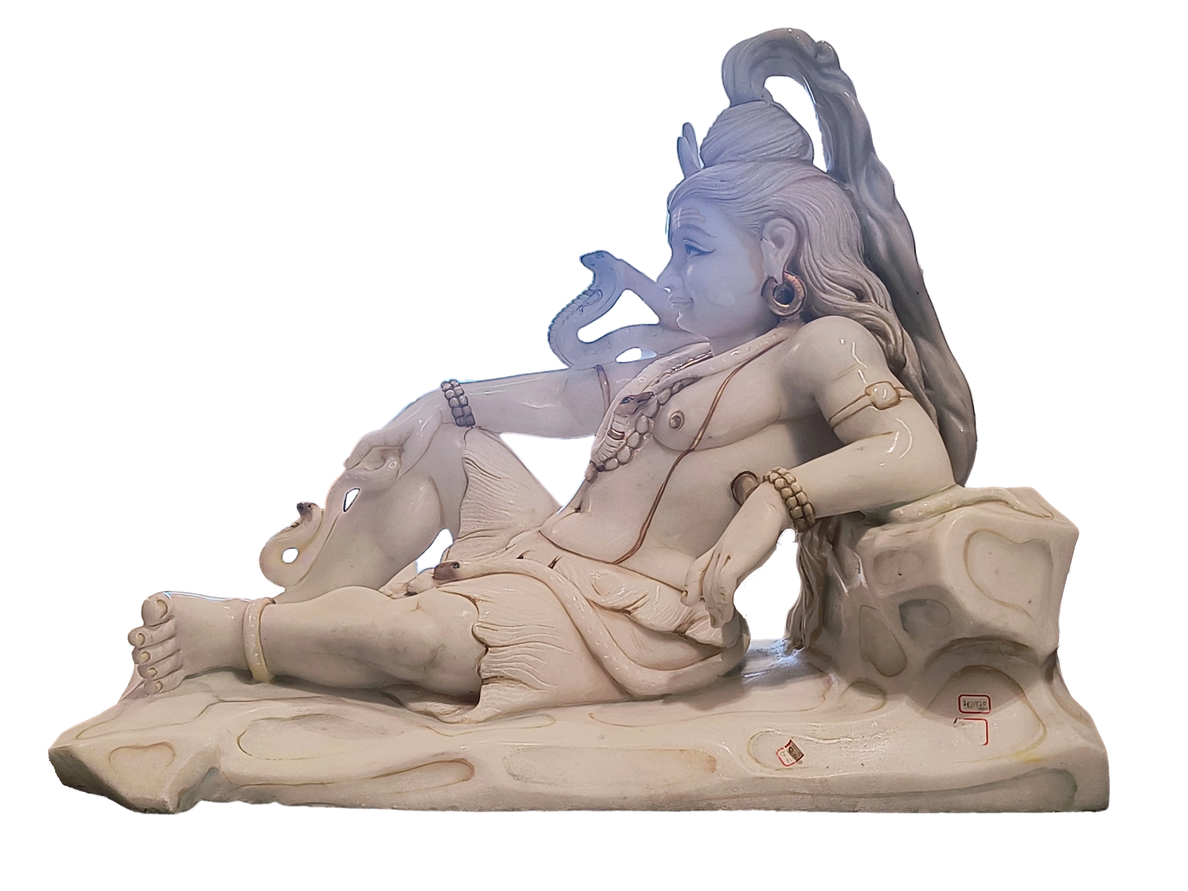 White marble sculpture of Shiva reclining with detailed jewelry and flowing hair