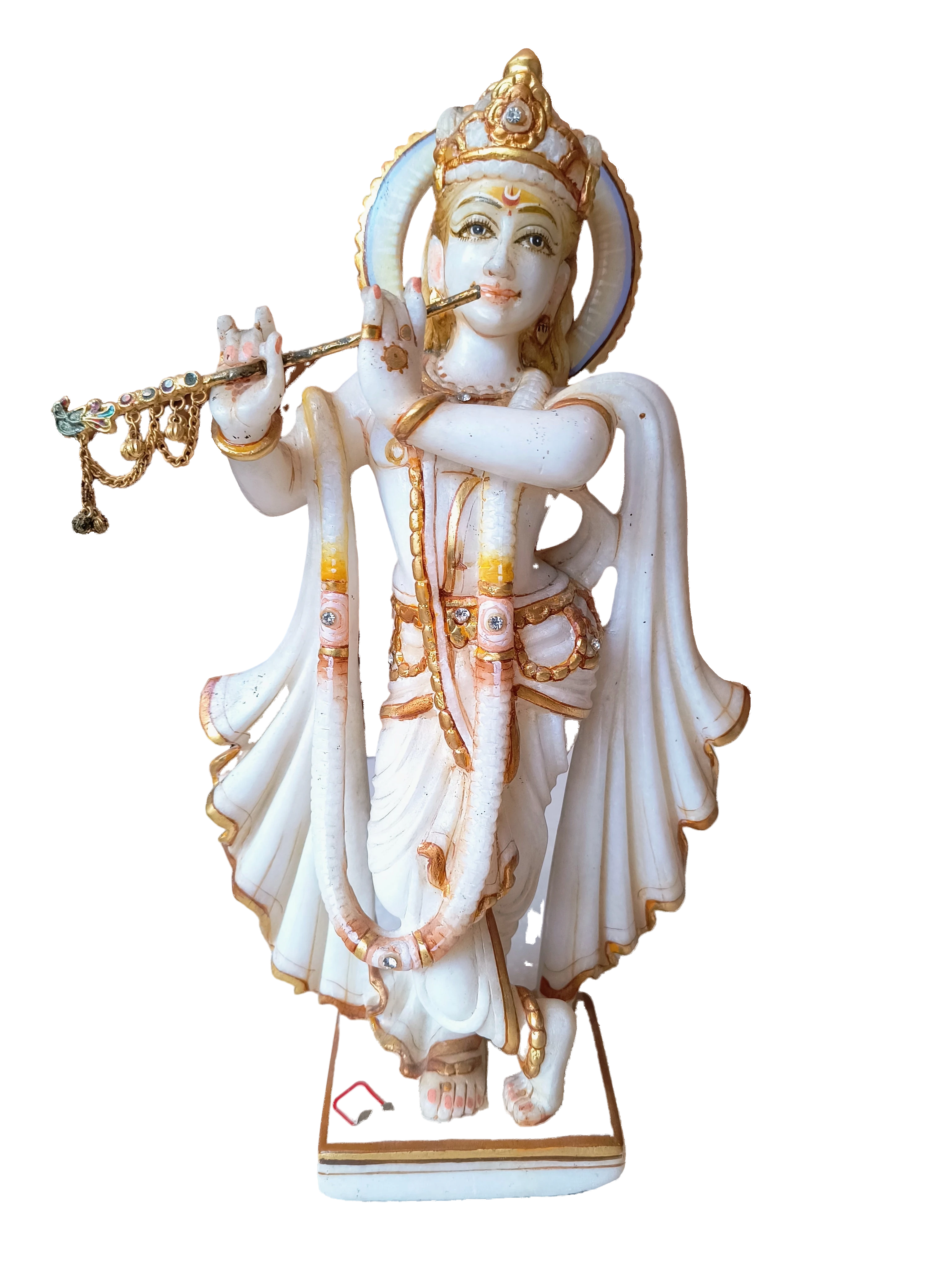 White marble sculpture of Krishna playing flute with gold and gem accents