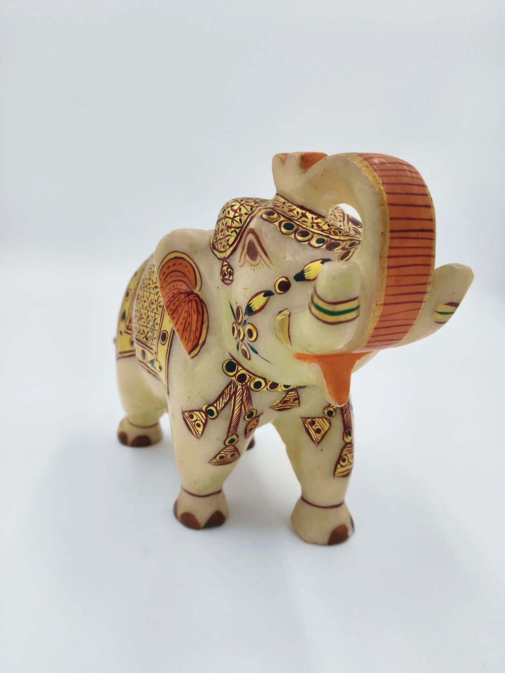 Hand-painted marble elephant figurine with detailed decorative patterns