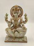 Front view of a 10.2 inch white marble Lakshmi statue seated on a lotus