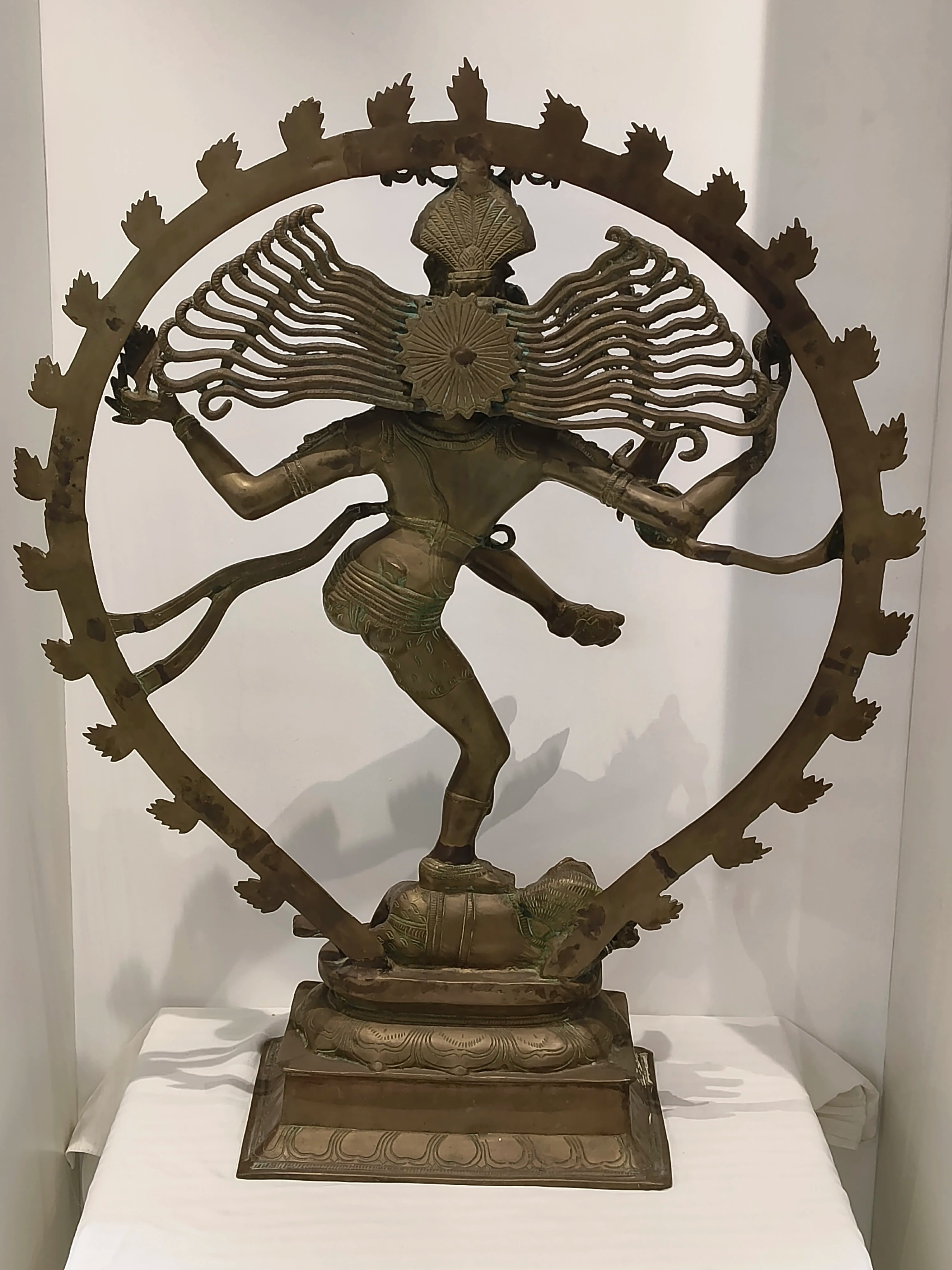 Large brass Nataraja statue of Shiva in cosmic dance with circular frame, rear view