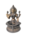Brass Lakshmi statue seated in lotus position with intricate detailing