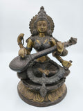 Brass 9-inch Saraswathi statue seated playing veena on decorative base