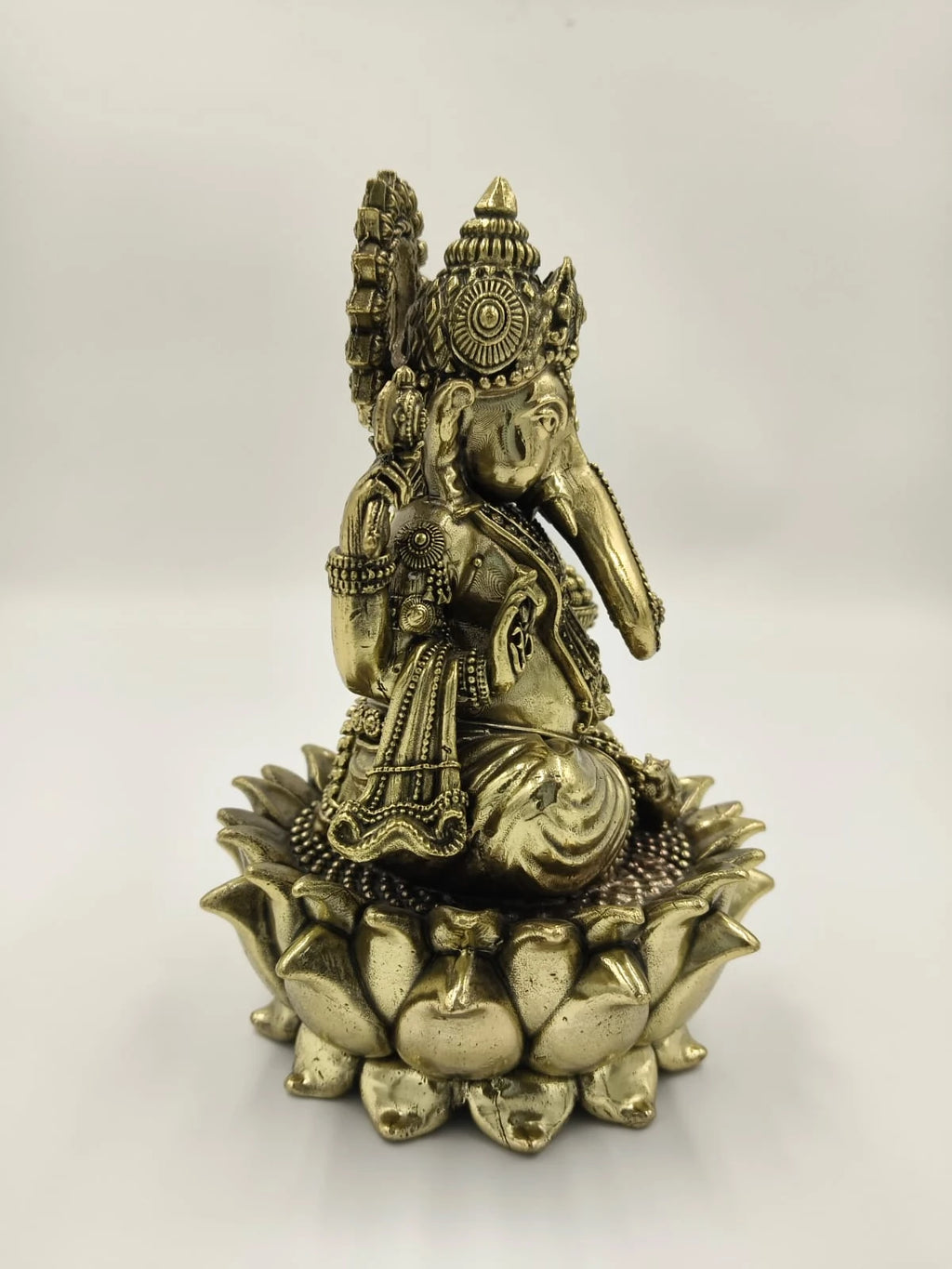 Brass statue of Padmasana Ganapati seated on a lotus flower